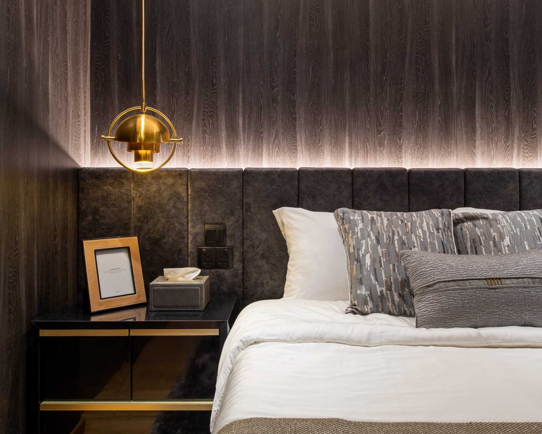 Modern Bedroom with Cove Lighting and Bedside Table