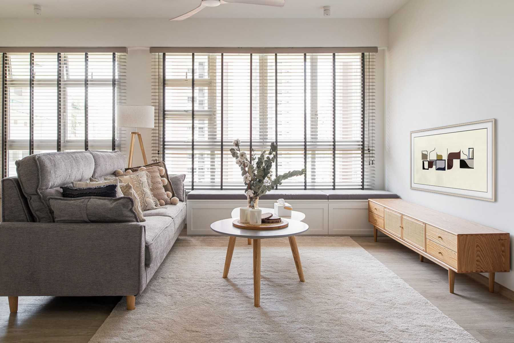 Scandinavian Living Room with TV Console and Bay Window