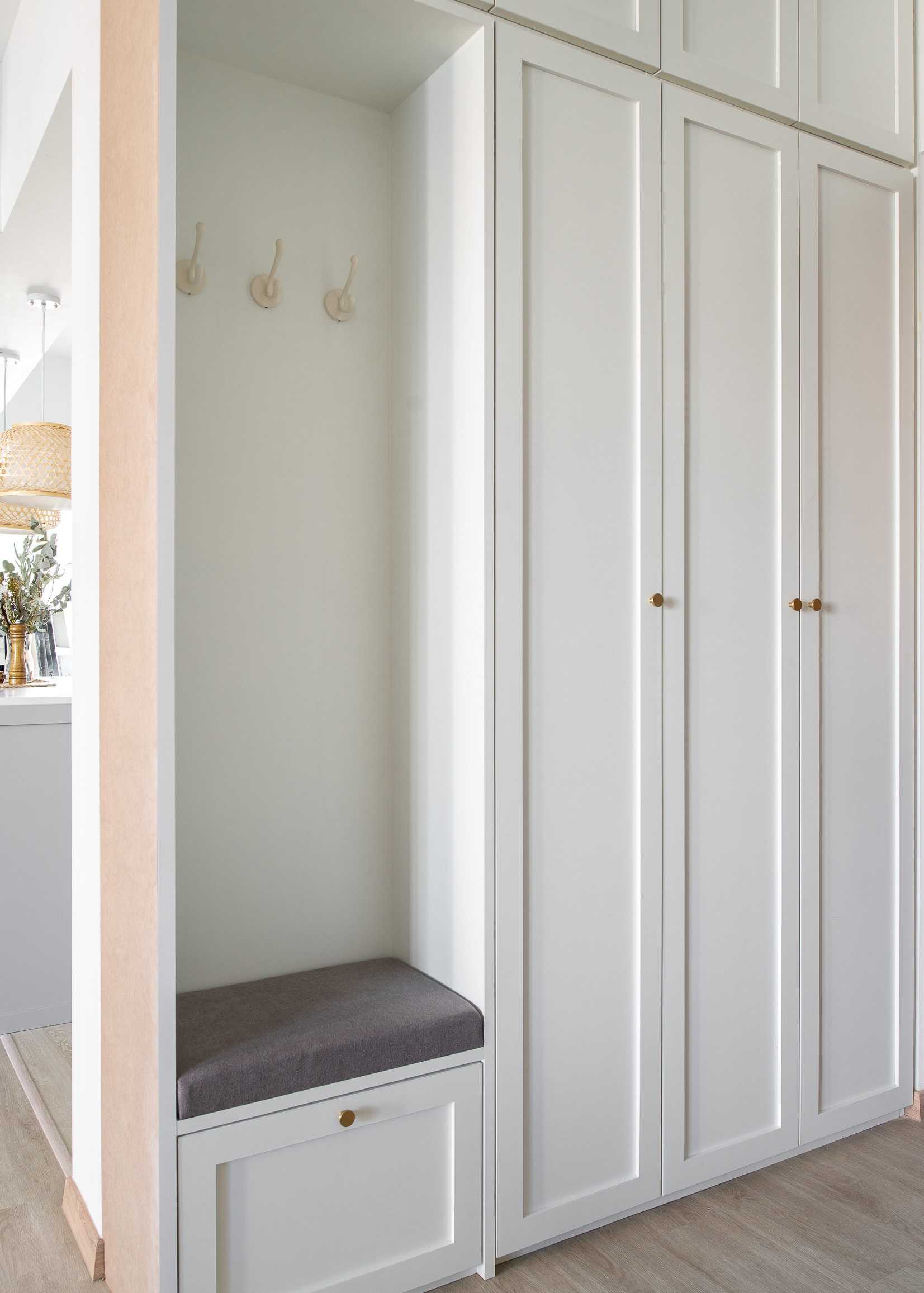 Scandinavian Entryway with Mirror and Seating Bench