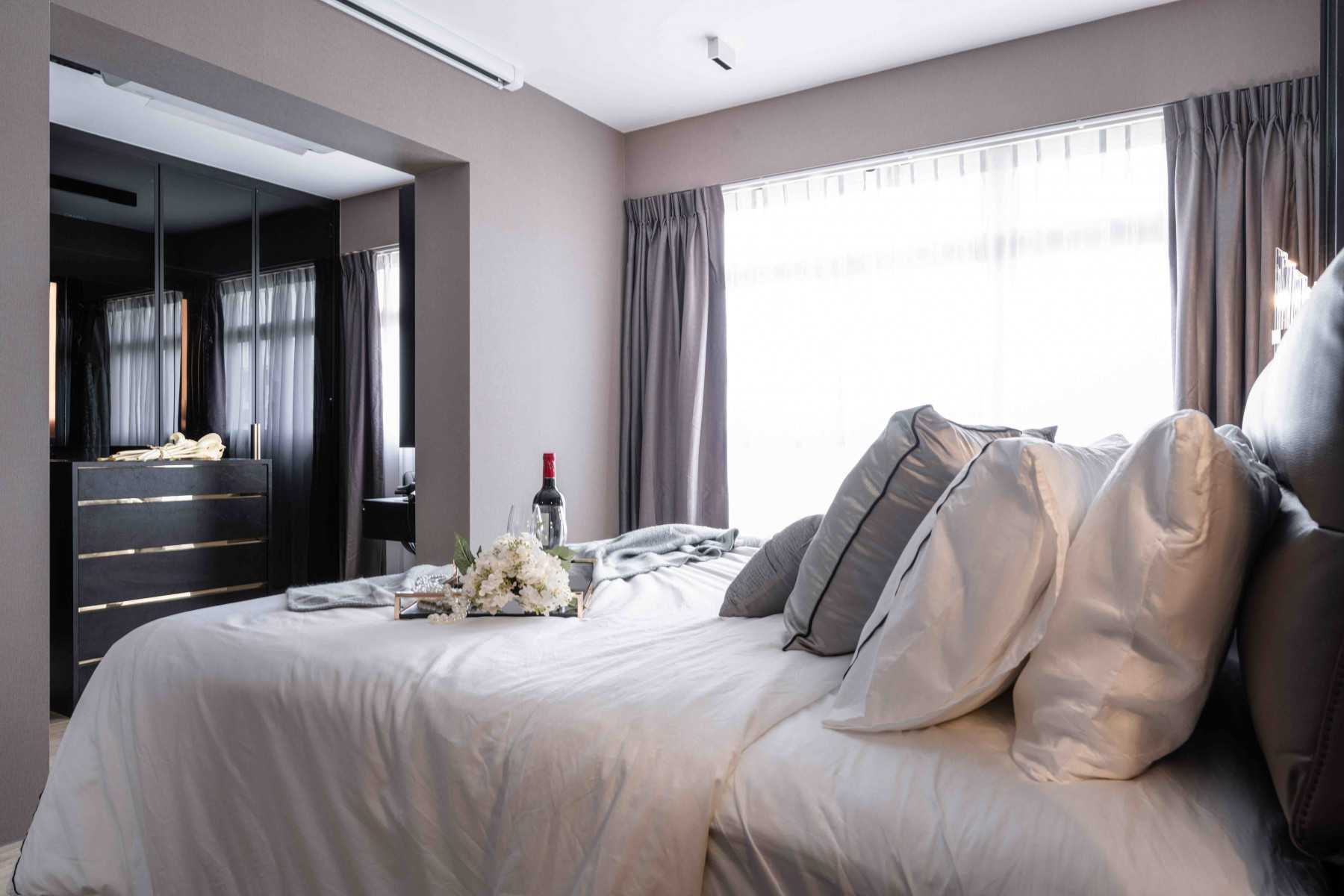 Contemporary Bedroom with Cove Lighting and Built-in Bed