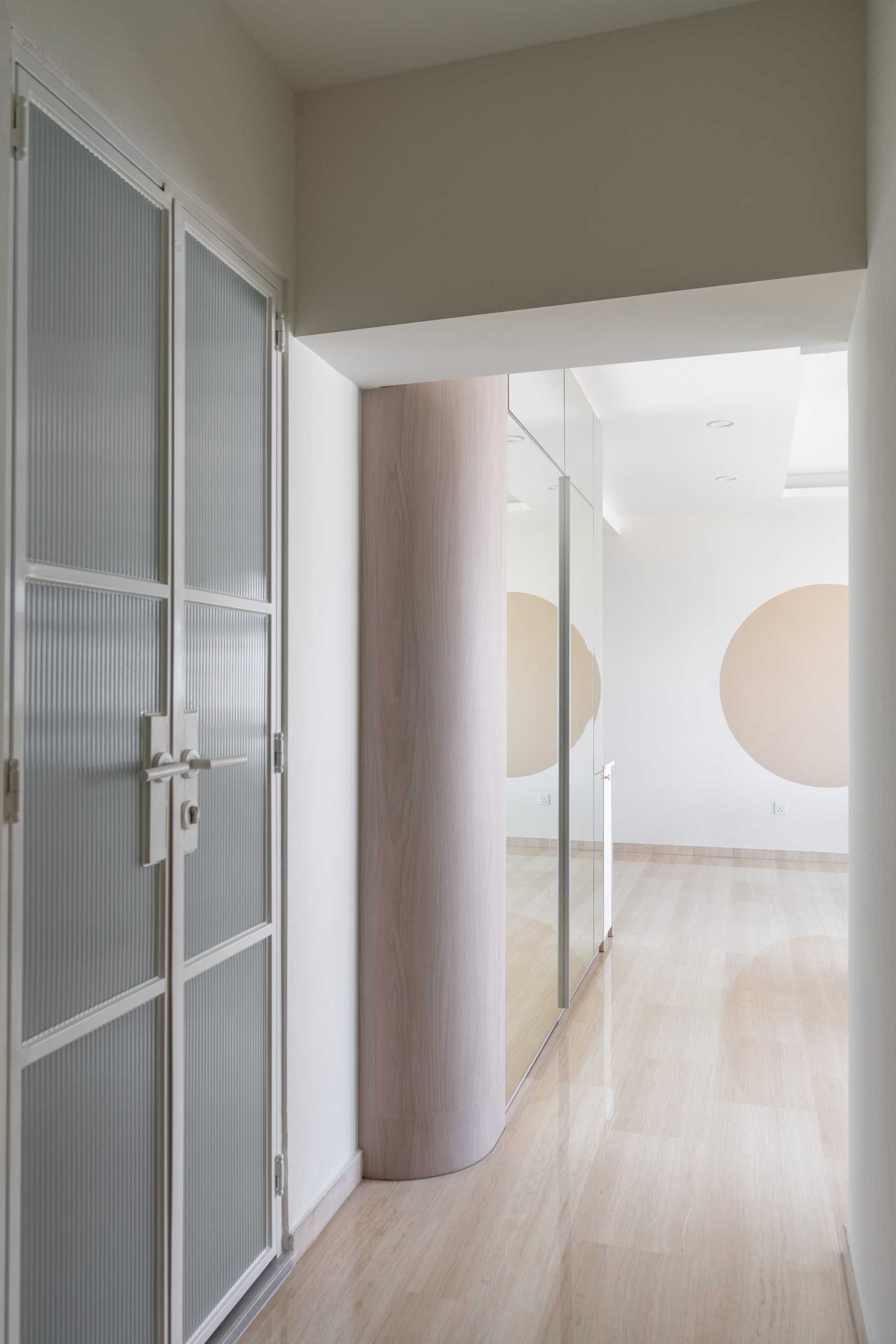 Minimalist Hallway with Vinyl Flooring and Storage Cabinets