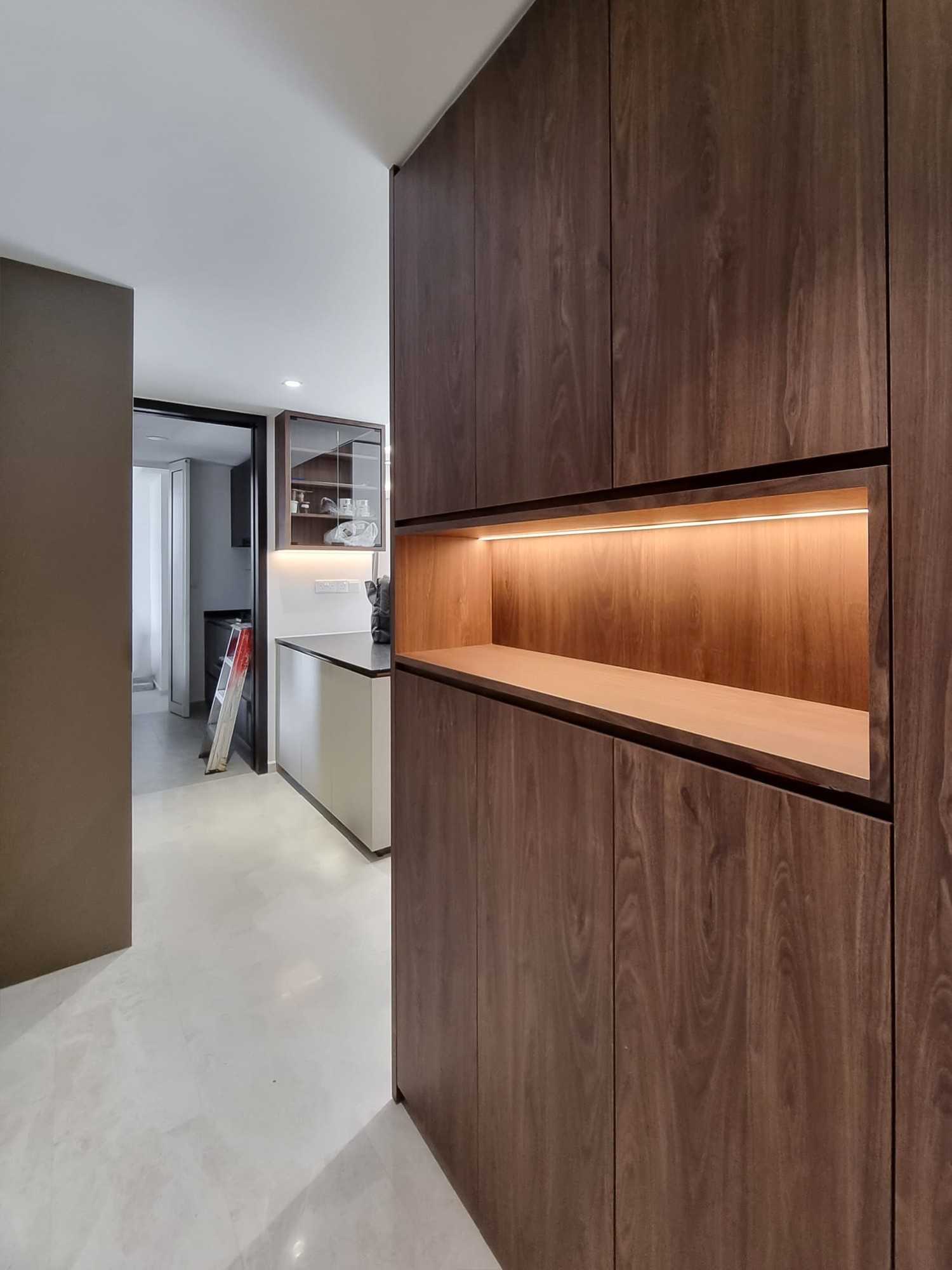 Scandinavian Foyer with Paintings and Storage Cabinets