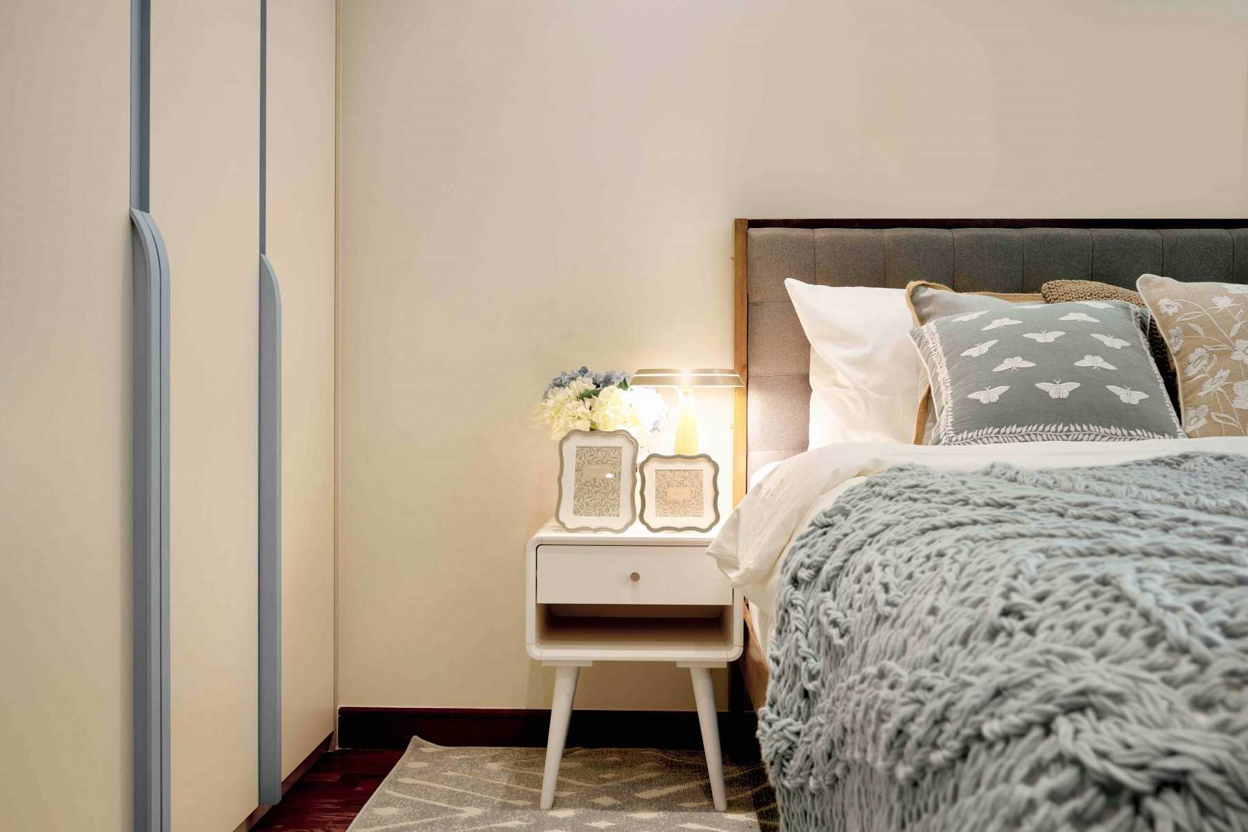 Transitional Bedroom with Cove Lighting and Bedside Table