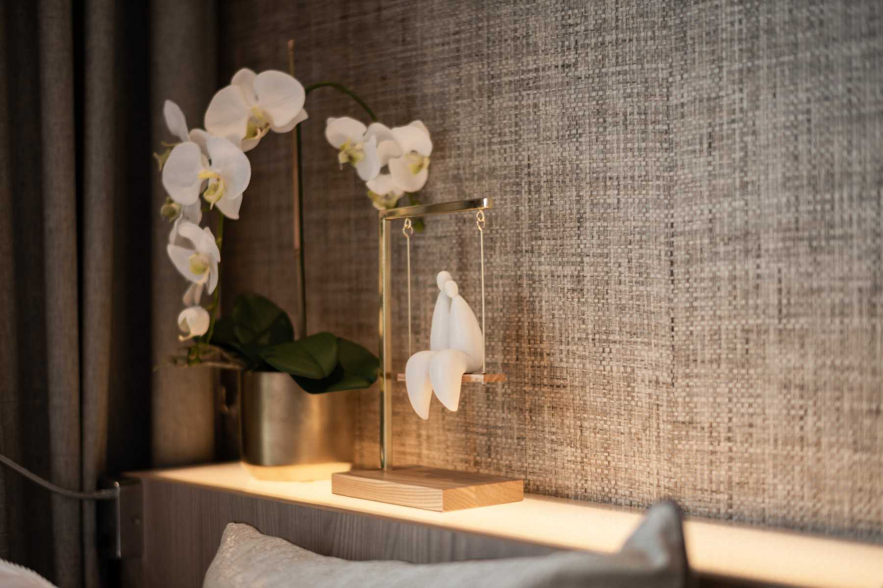 Contemporary Bedroom with Cove Lighting and Bedside Table