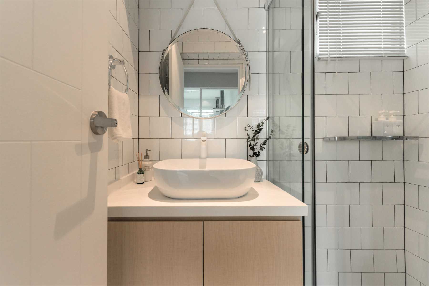 Scandinavian Bathroom with Countertop and Mirror