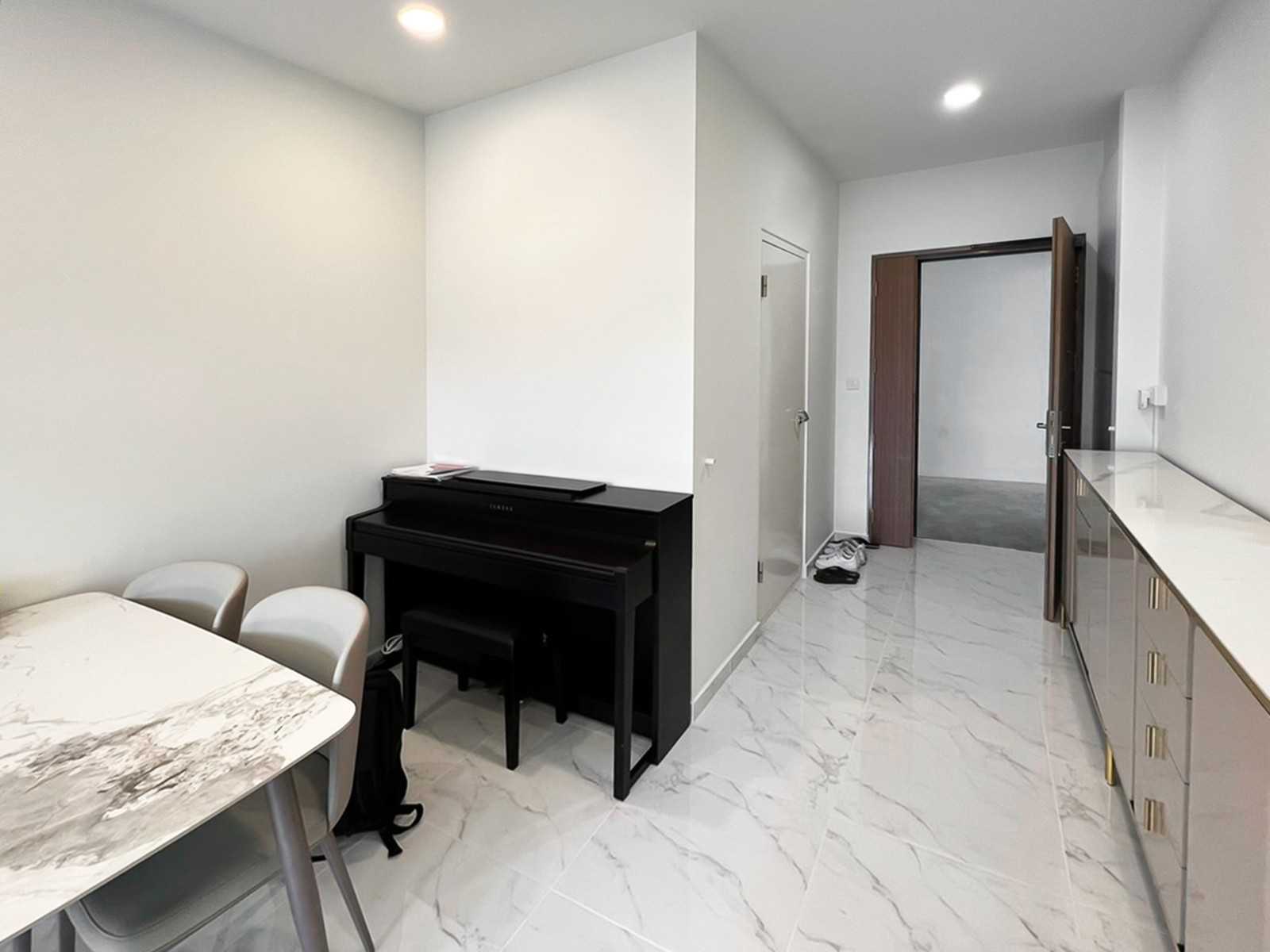 Modern Foyer with Paintings and Storage Cabinets
