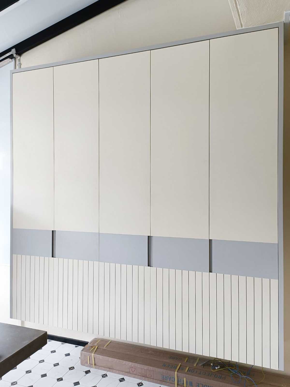 Scandinavian Foyer with Paintings and Storage Cabinets
