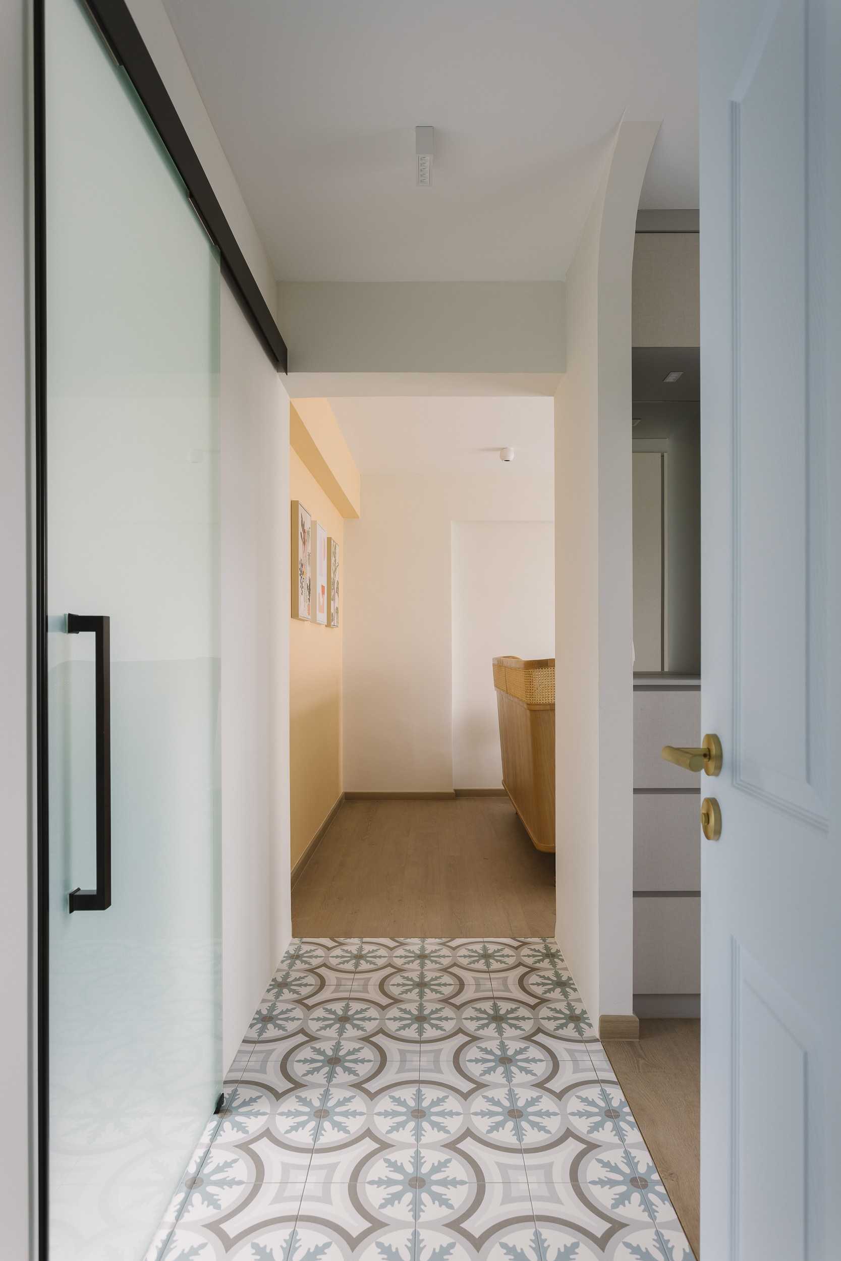 Contemporary Hallway with Artwork and Storage Cabinets
