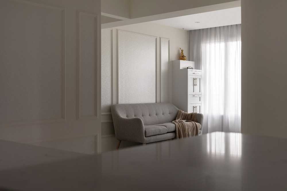 Transitional Living Room with Bookshelf and Feature Wall