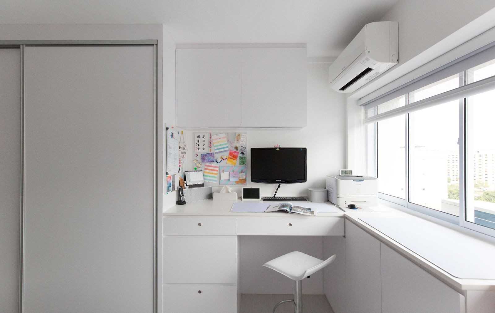 Minimalist Bedroom with Bookshelf and Drop Light