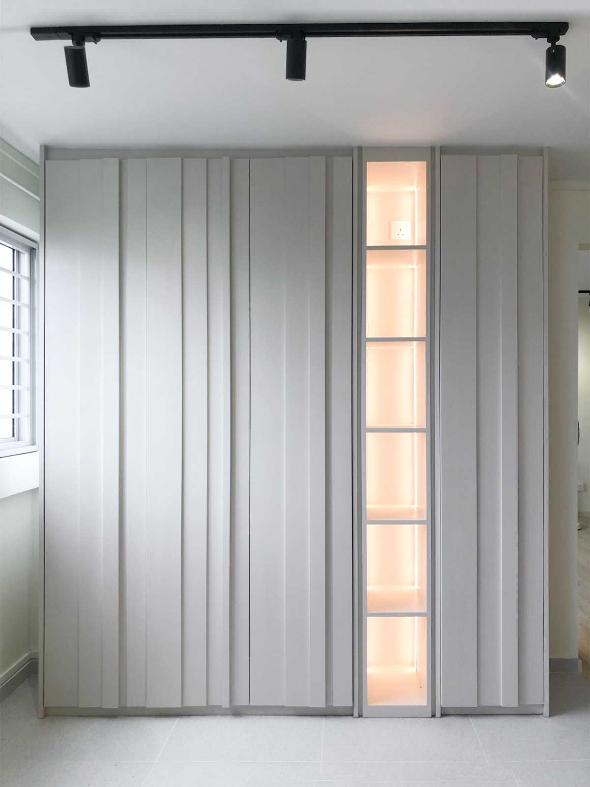 Scandinavian Foyer with Paintings and Storage Cabinets