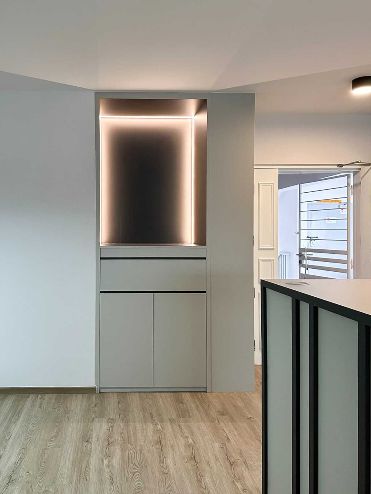 Scandinavian Foyer with Paintings and Storage Cabinets