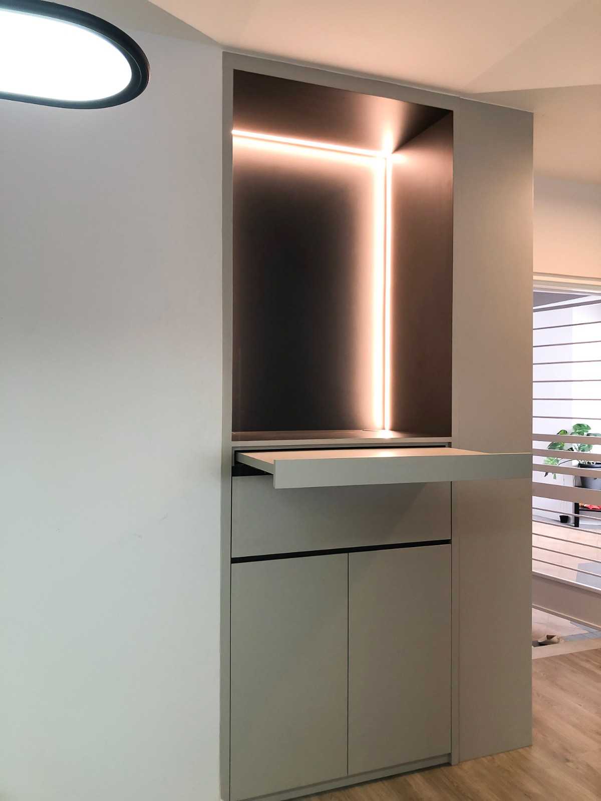 Scandinavian Foyer with Paintings and Storage Cabinets