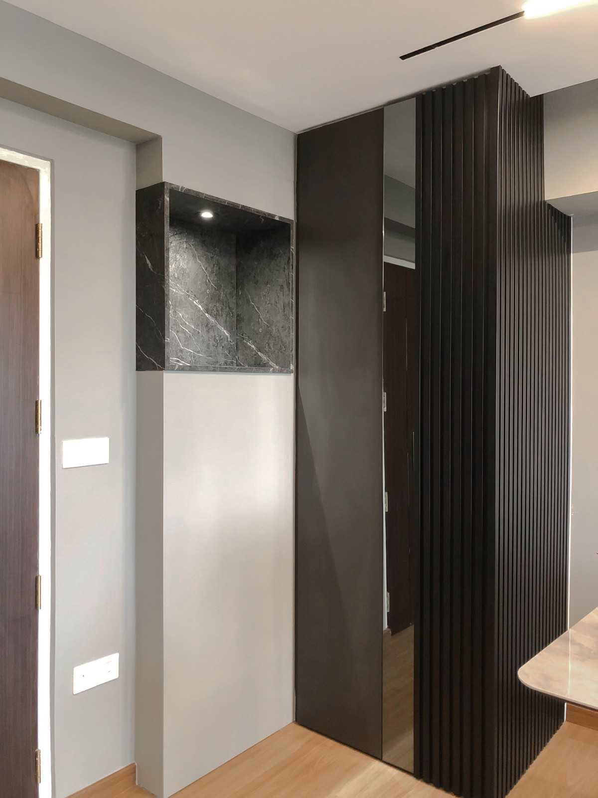 Modern Foyer with Paintings and Storage Cabinets