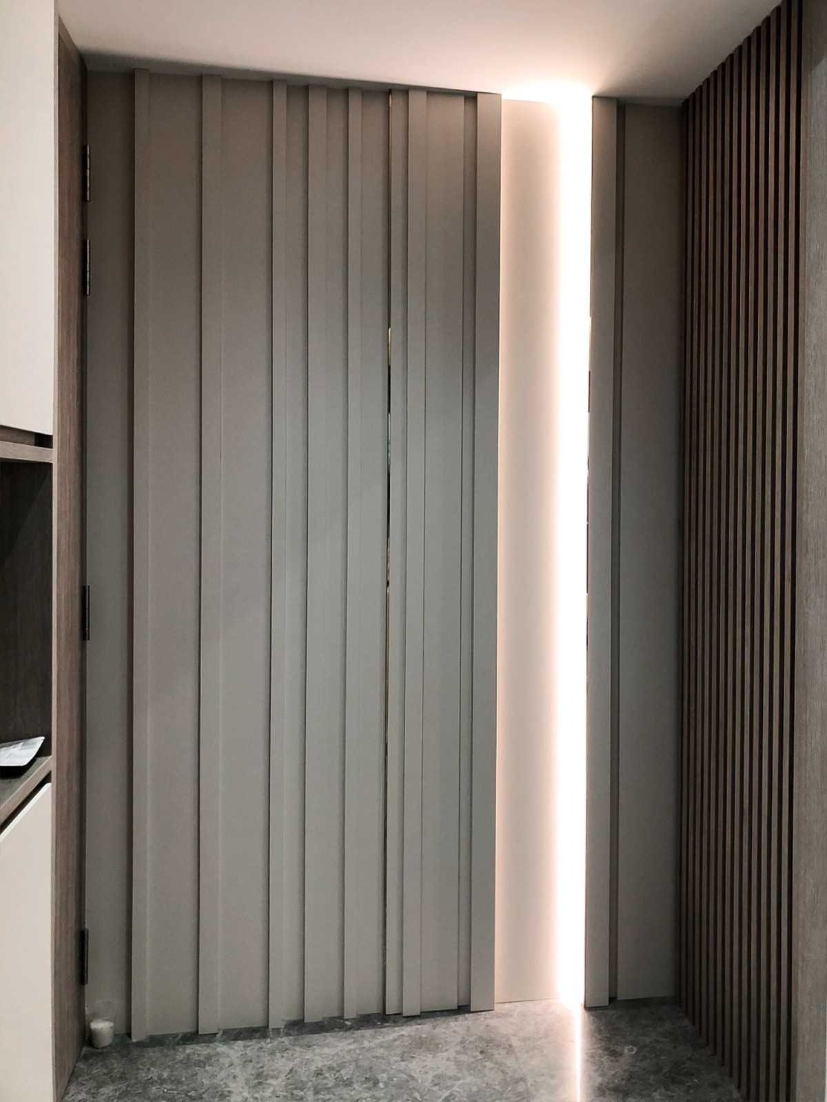 Scandinavian Foyer with Paintings and Display Cabinets