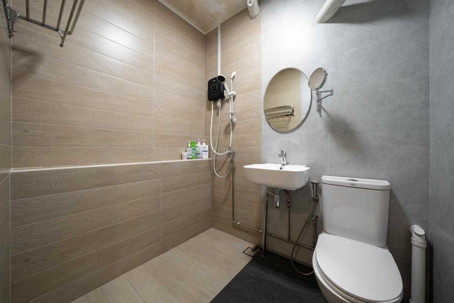 Minimalist Bathroom with Wood Flooring and Mirror