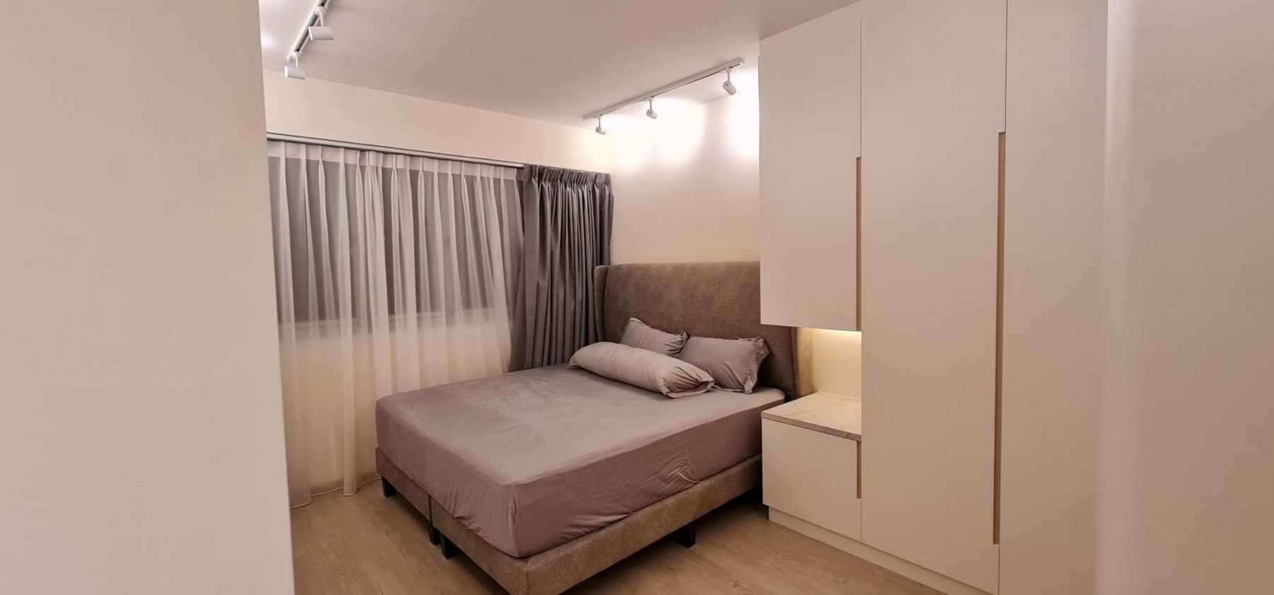 Minimalist Bedroom with Vinyl Flooring and Ceiling Light