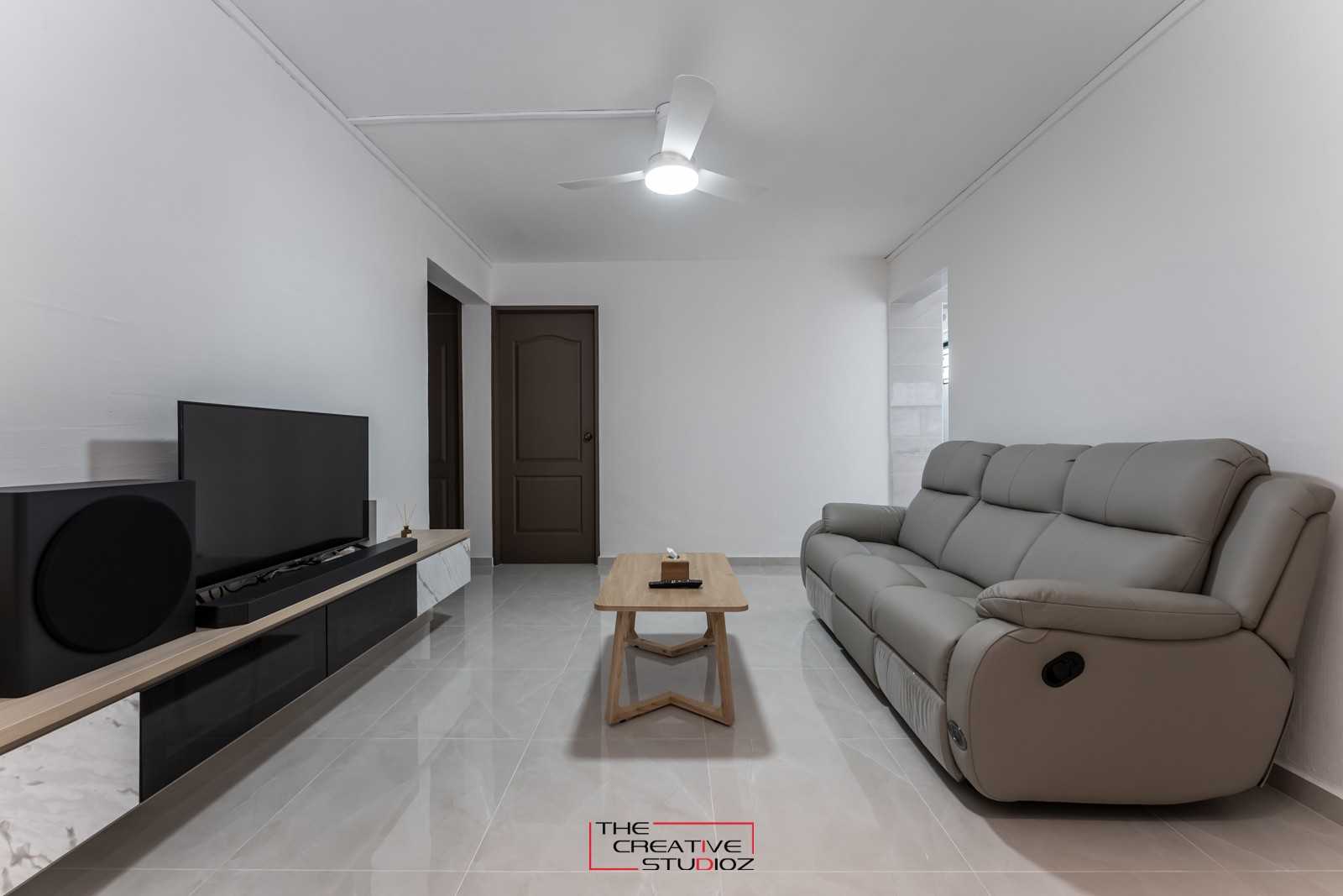 Scandinavian Living Room with Homogeneous Tiles and TV Console
