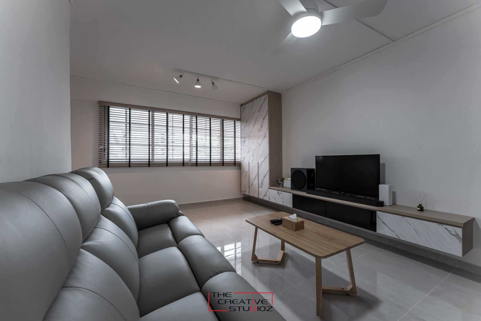Scandinavian Living Room with Homogeneous Tiles and TV Console