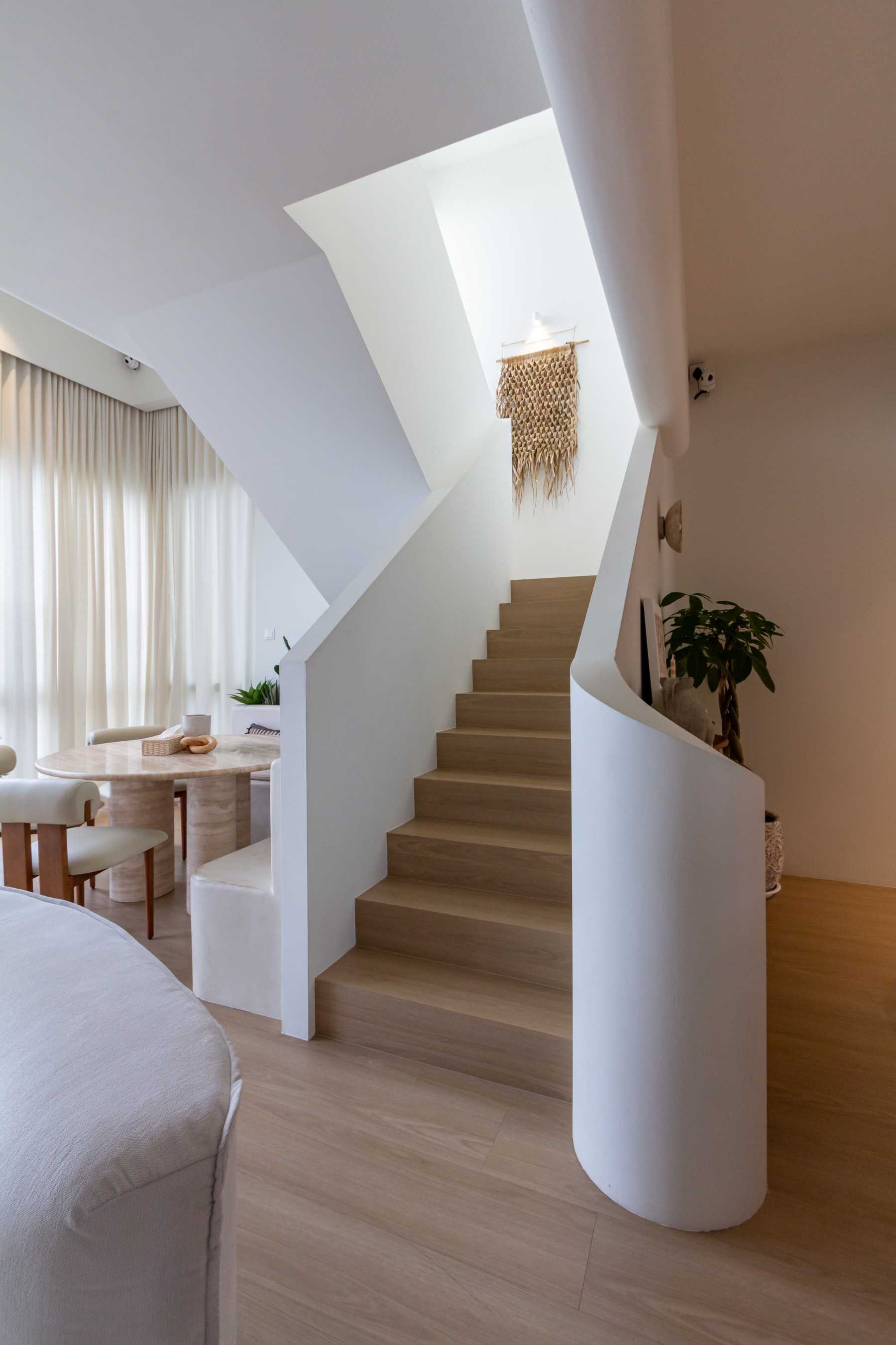 Minimalist Living Room with Staircase and Dining Table