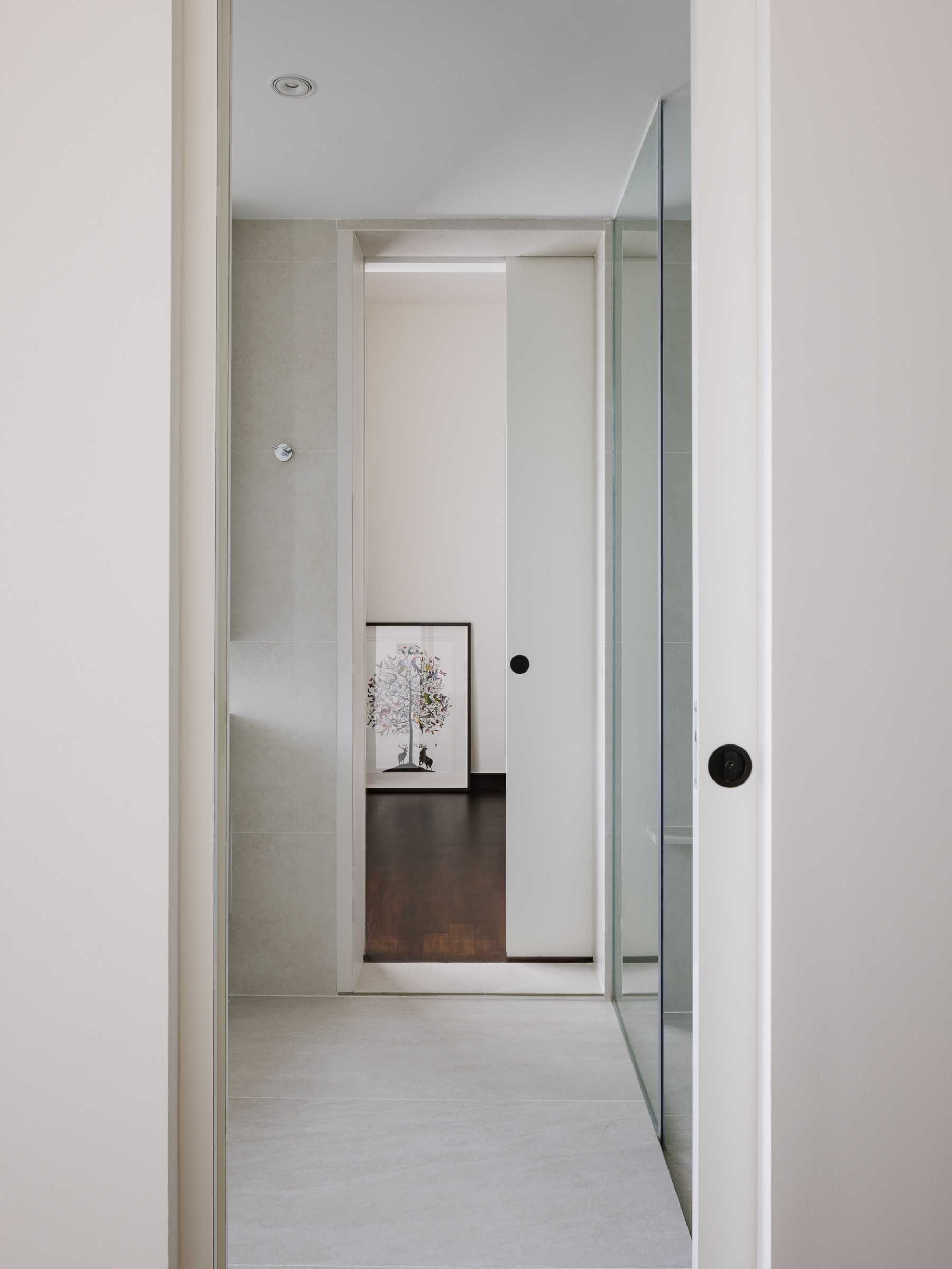 Contemporary Bedroom with Artwork and Shower Screen