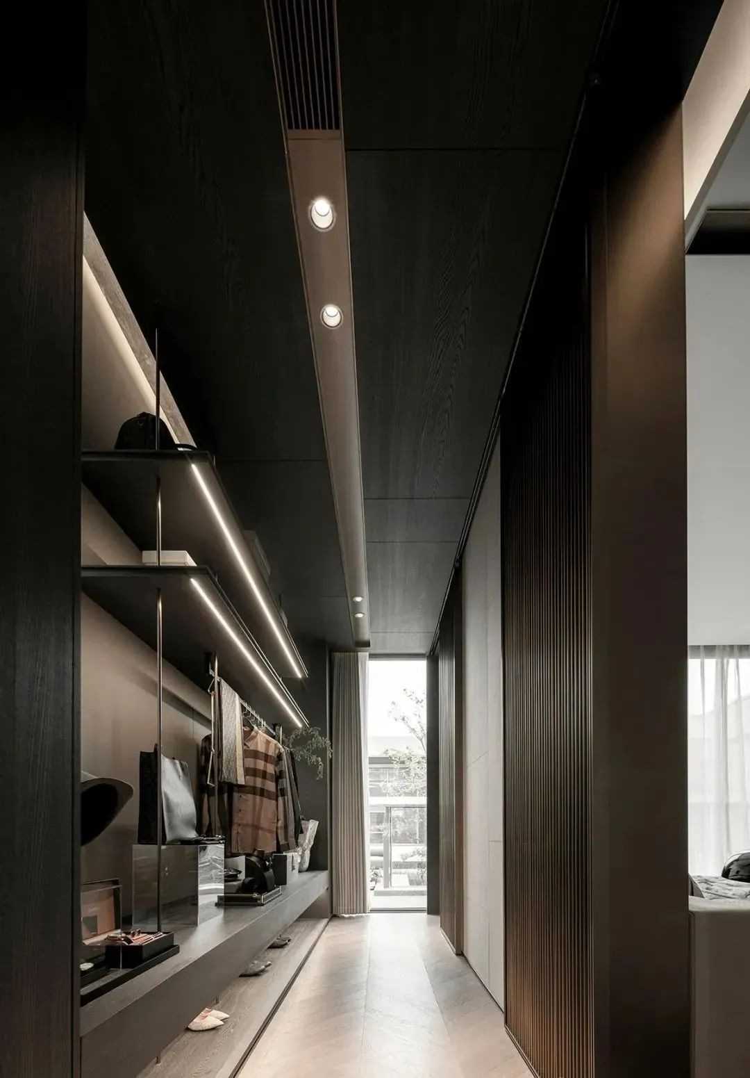 Contemporary Walk-in Wardrobe with Herringbone Tiling and Mirror