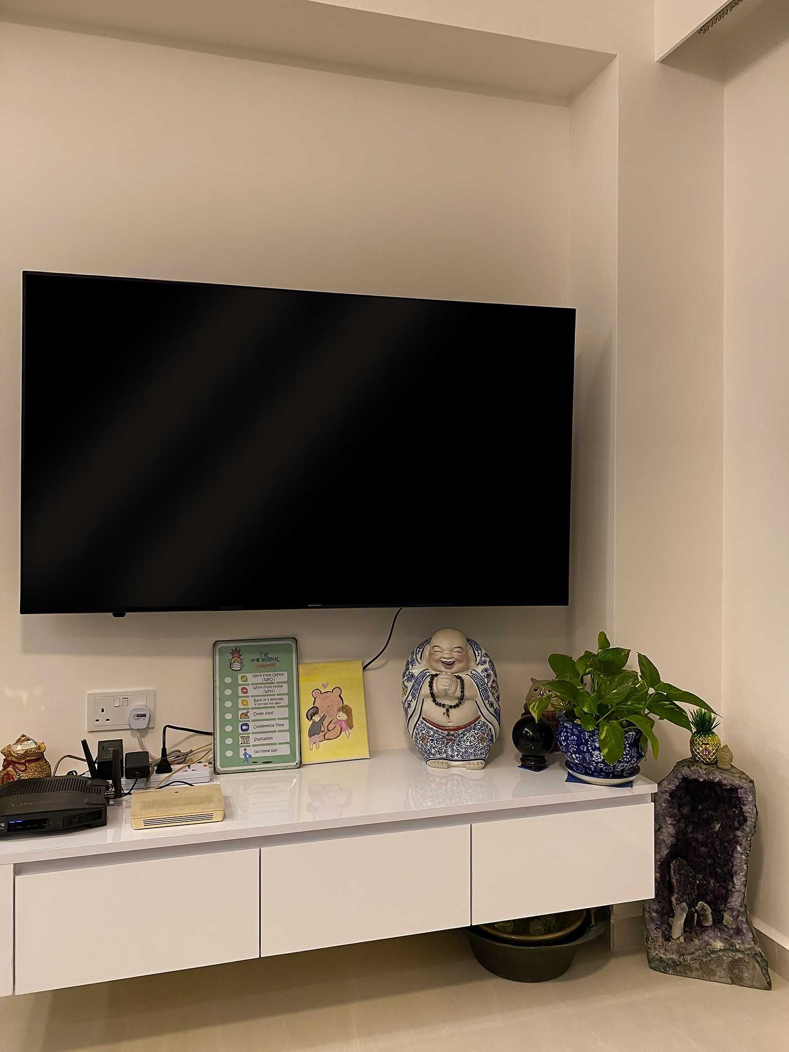 Scandinavian Living Room with TV Console and Paintings
