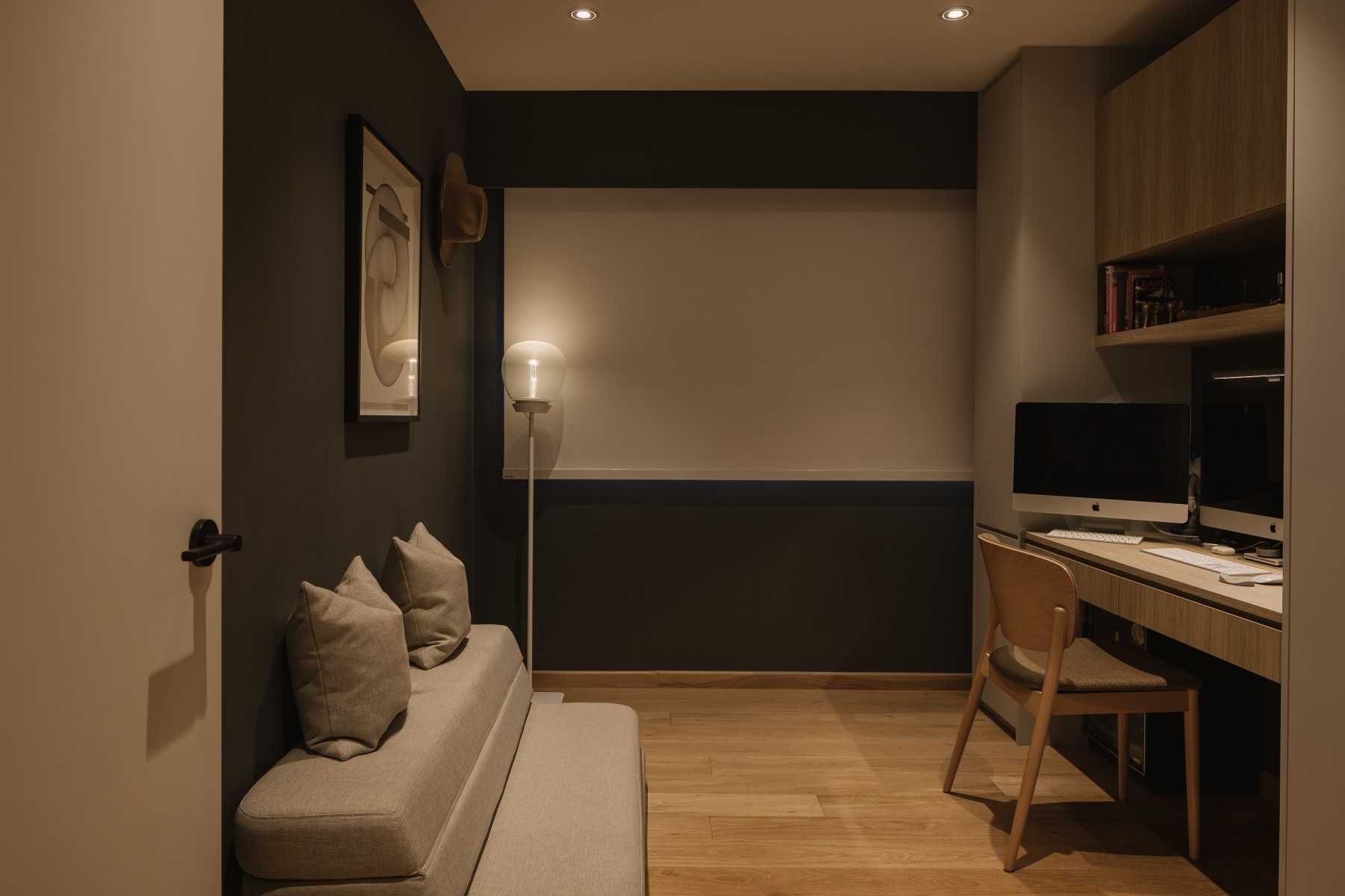 Modern Home Office with Bookshelf and Desk Chairs