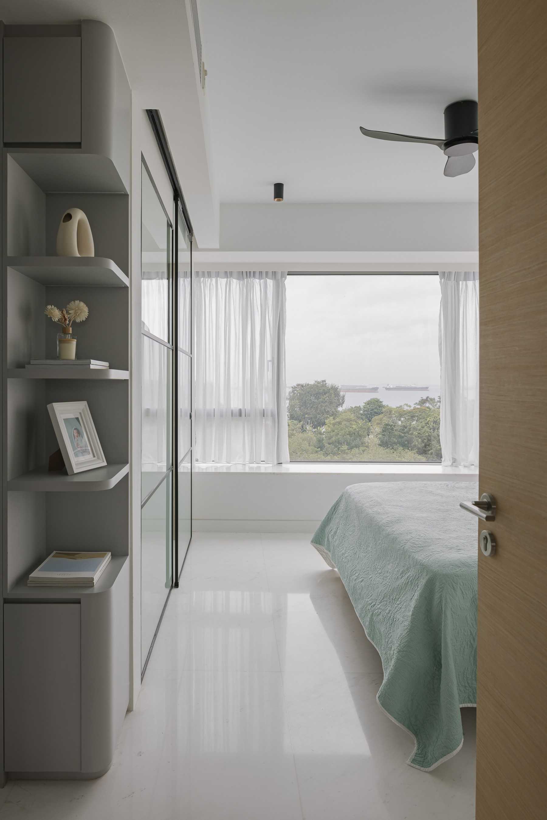 Modern Bedroom with Bay Window and Ceiling Light