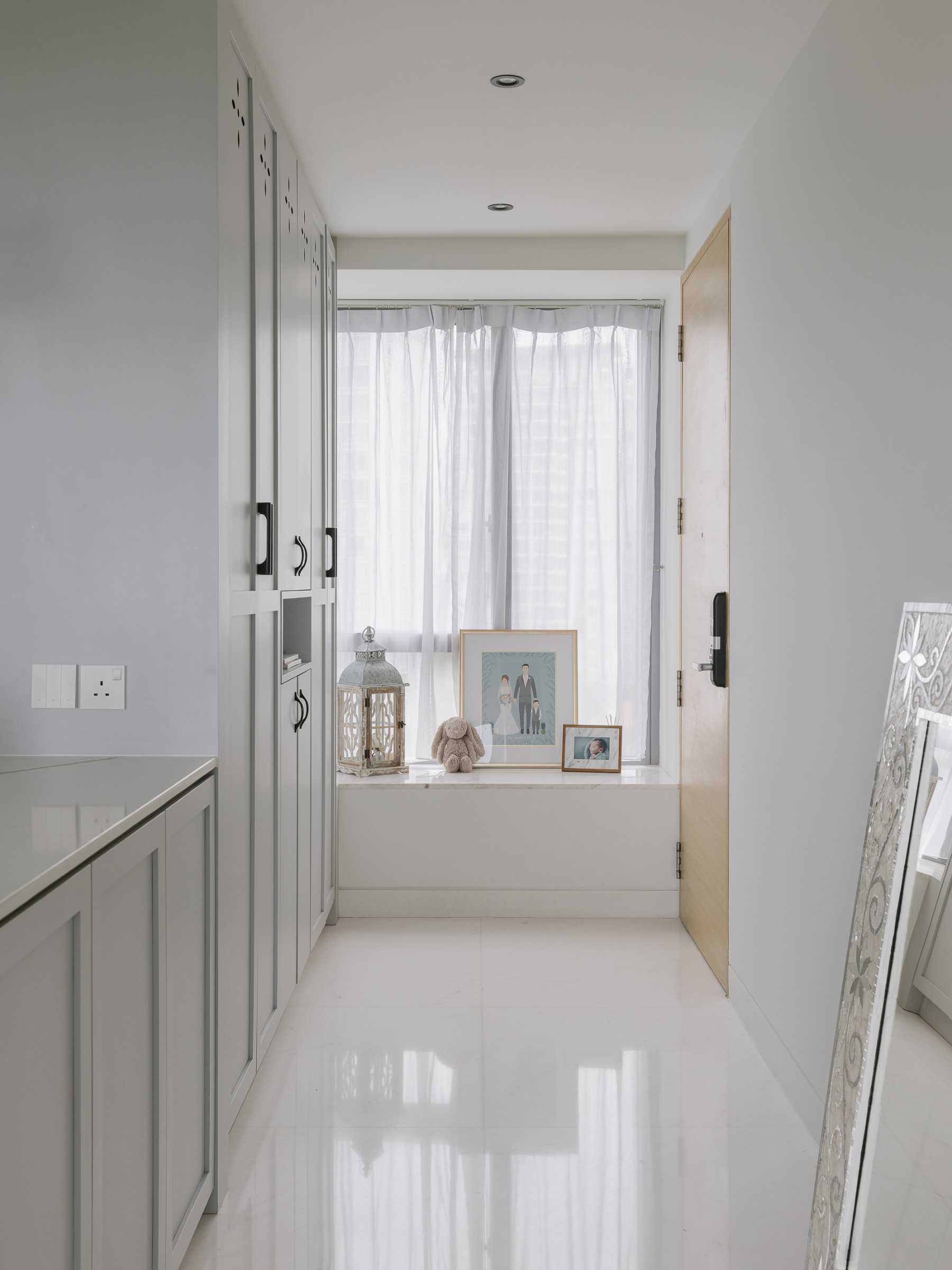 Modern Entryway with Mirror and Bay Window