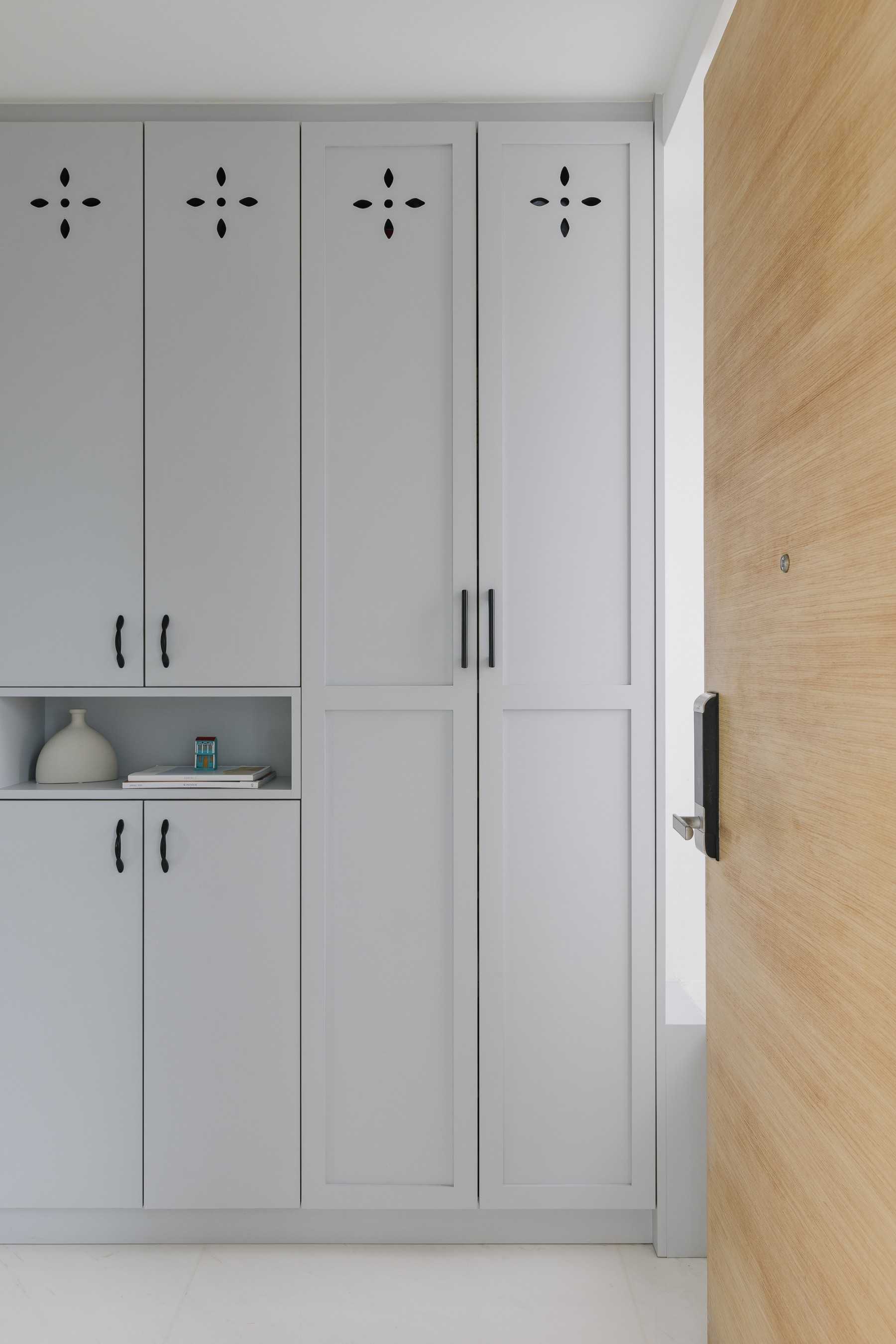 Modern Entryway with Storage Cabinets and Small Storage