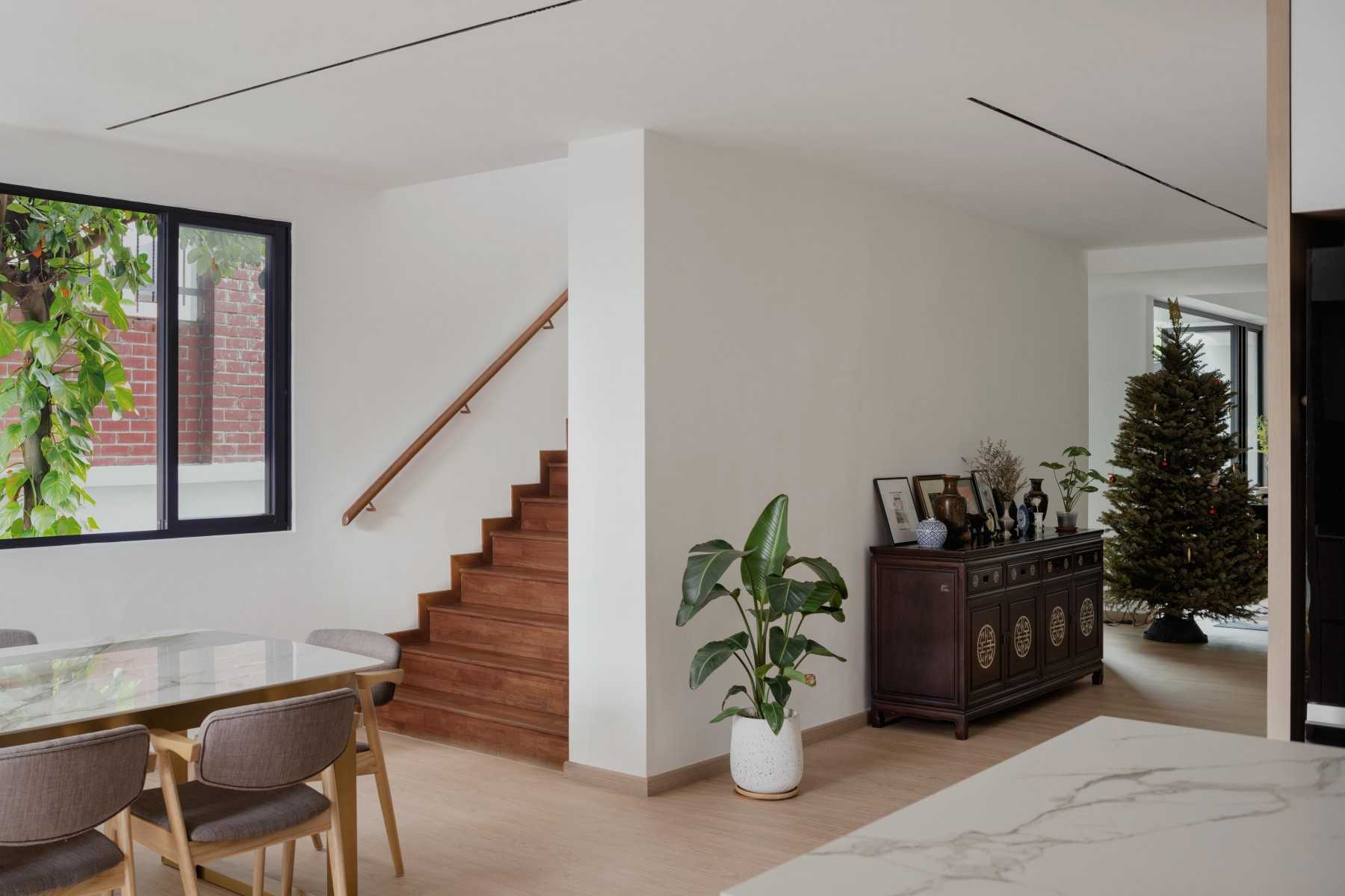 Scandinavian Foyer with Kitchen Island and Staircase