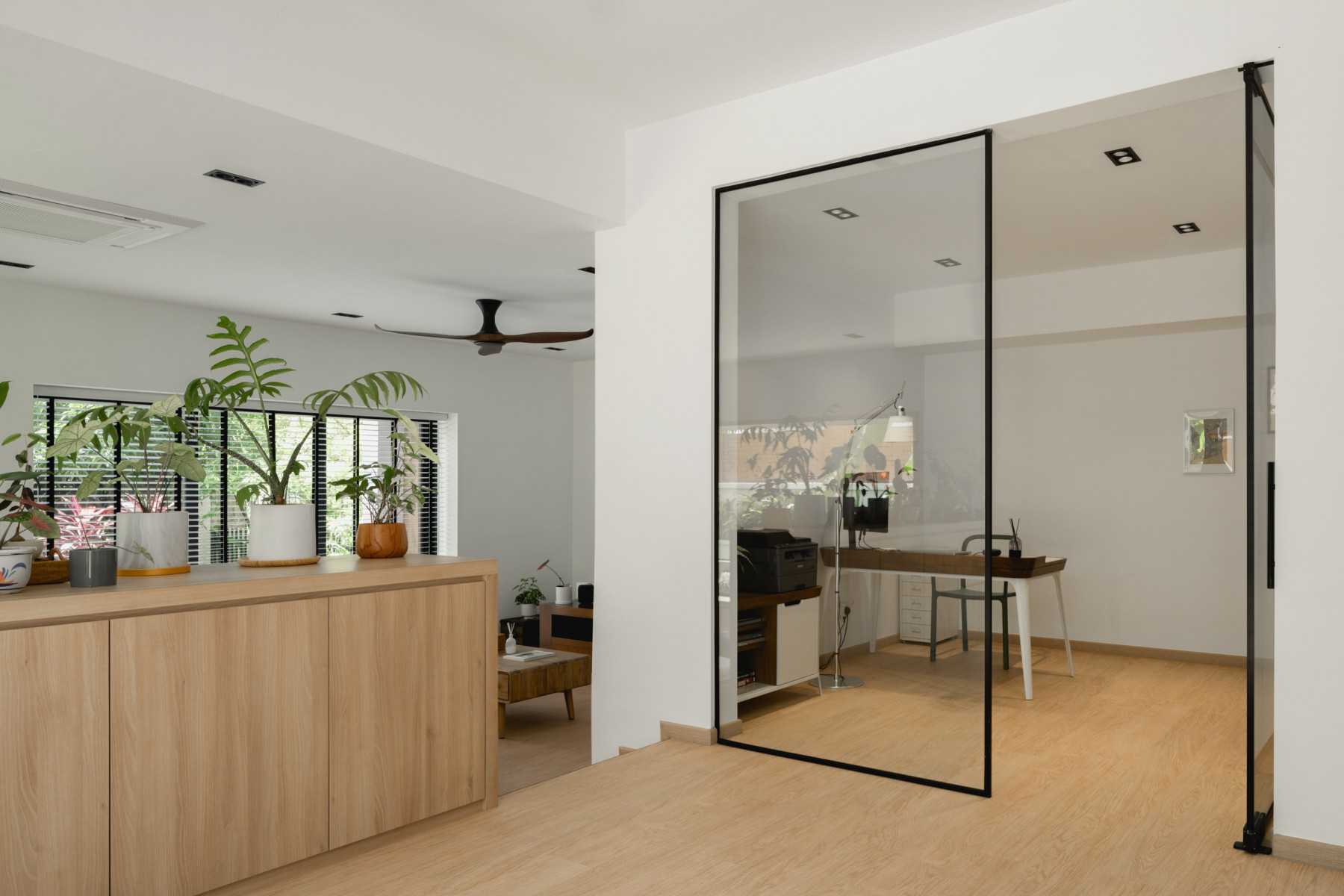 Scandinavian Foyer with Wood Flooring and Desk Chairs