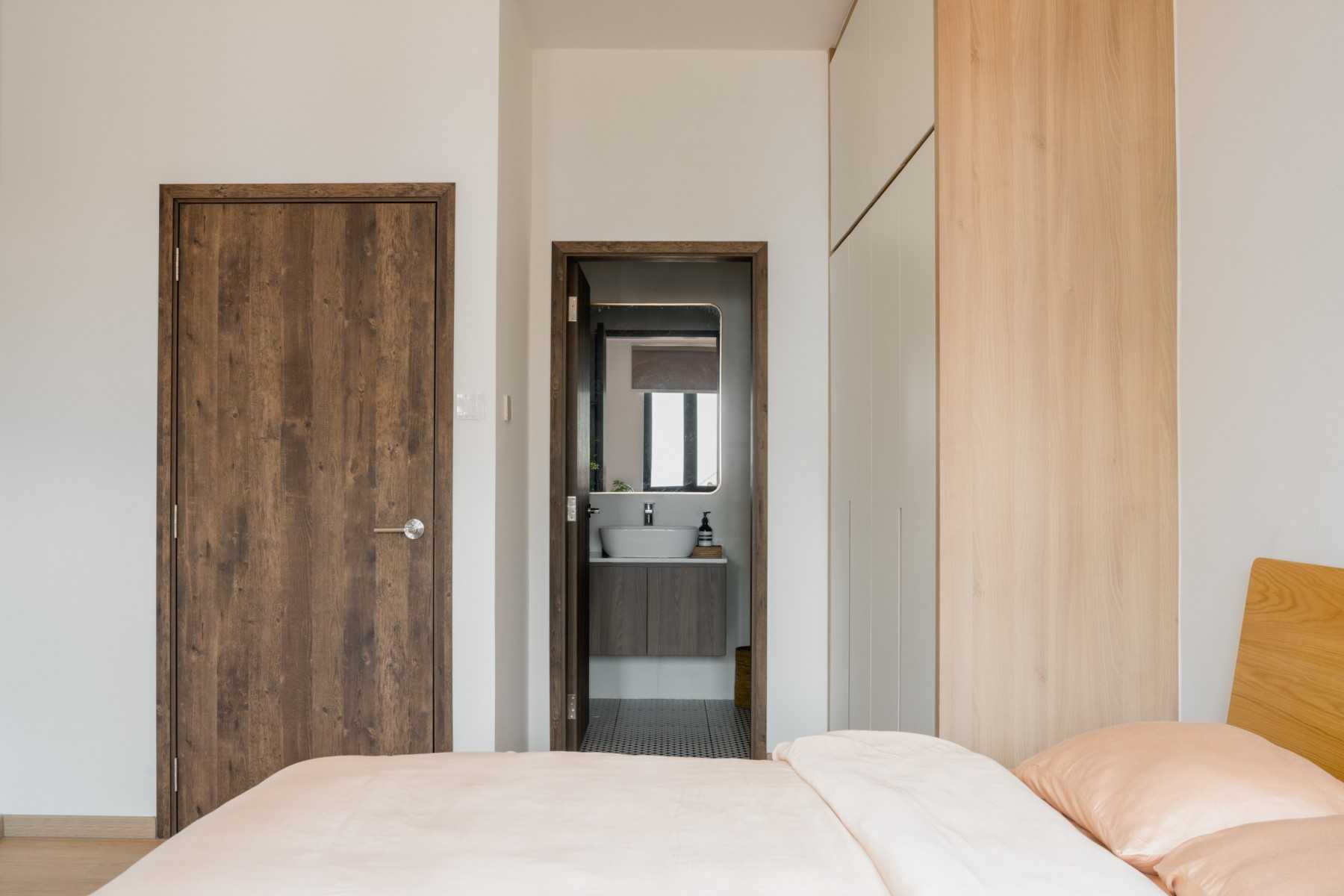 Scandinavian Bedroom with Wood Flooring and Mirror