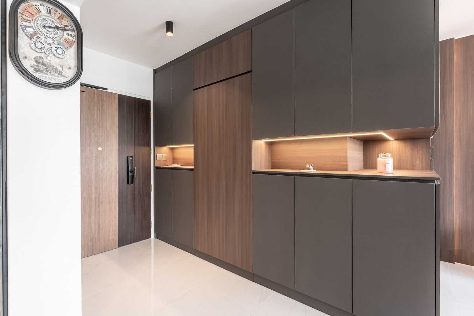 Modern Foyer with Feature Wall and Storage Cabinets