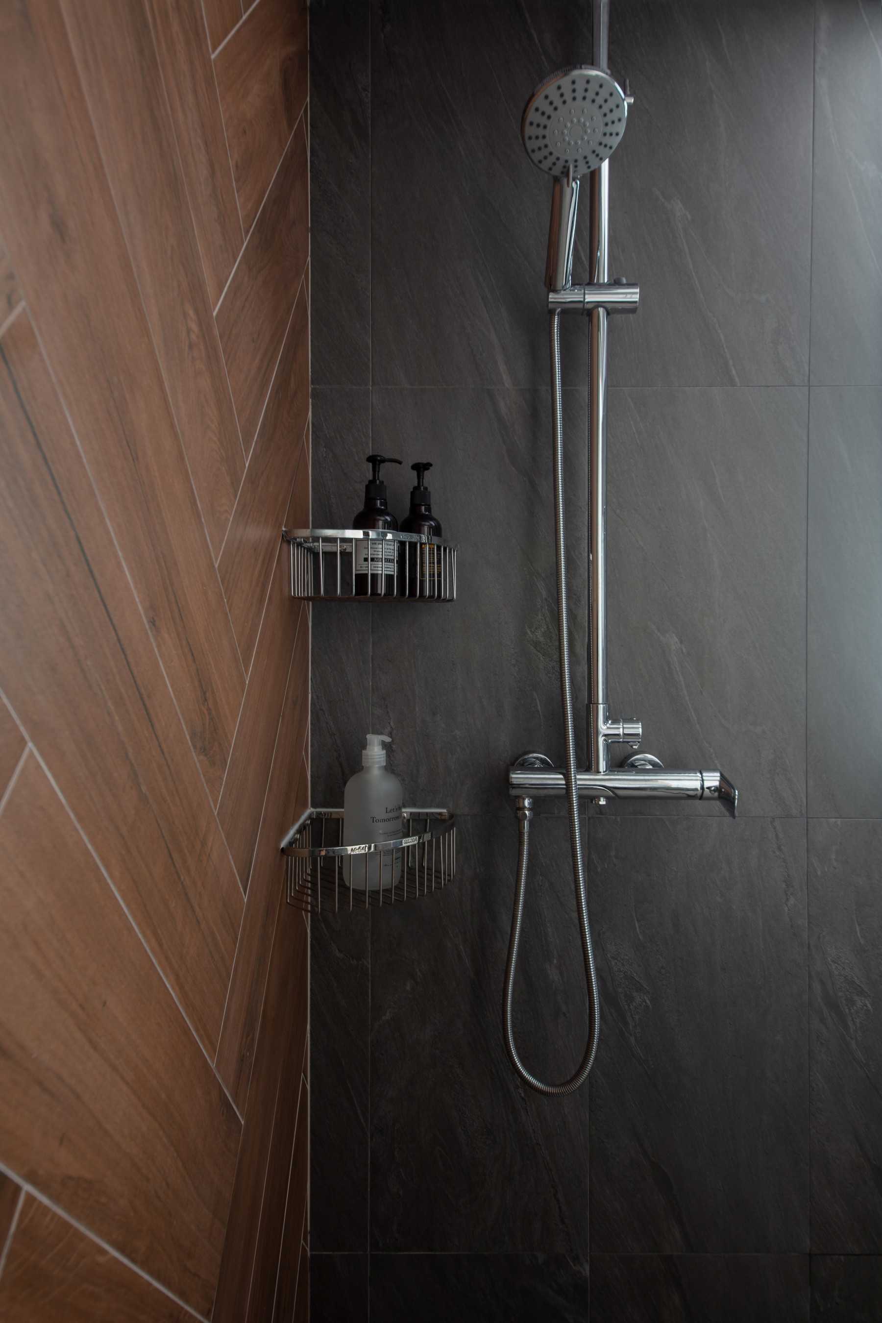 Scandinavian Bathroom with Herringbone Tiling and Showers