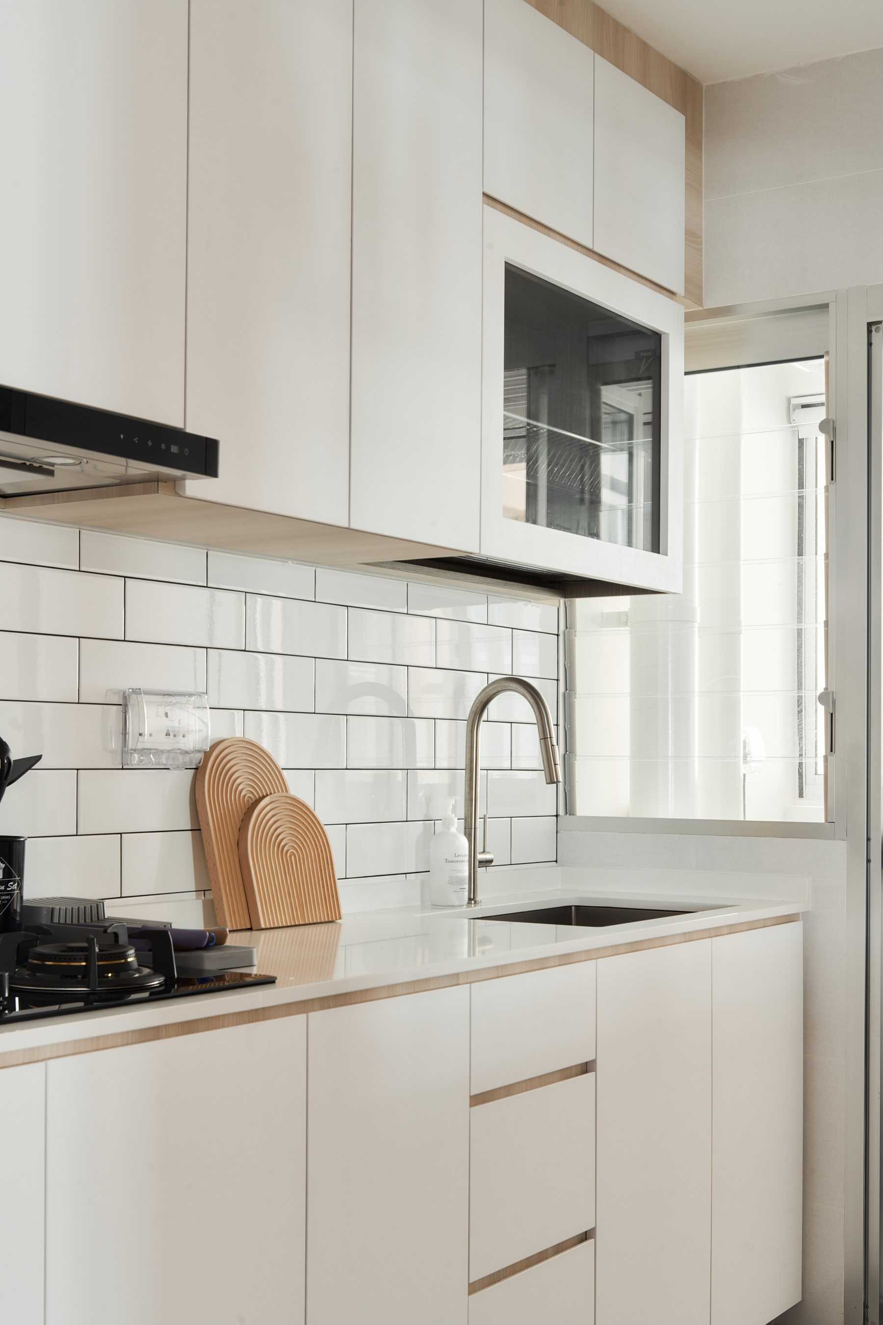 Scandinavian Kitchen with Kitchen Backsplash and Kitchen Cabinets