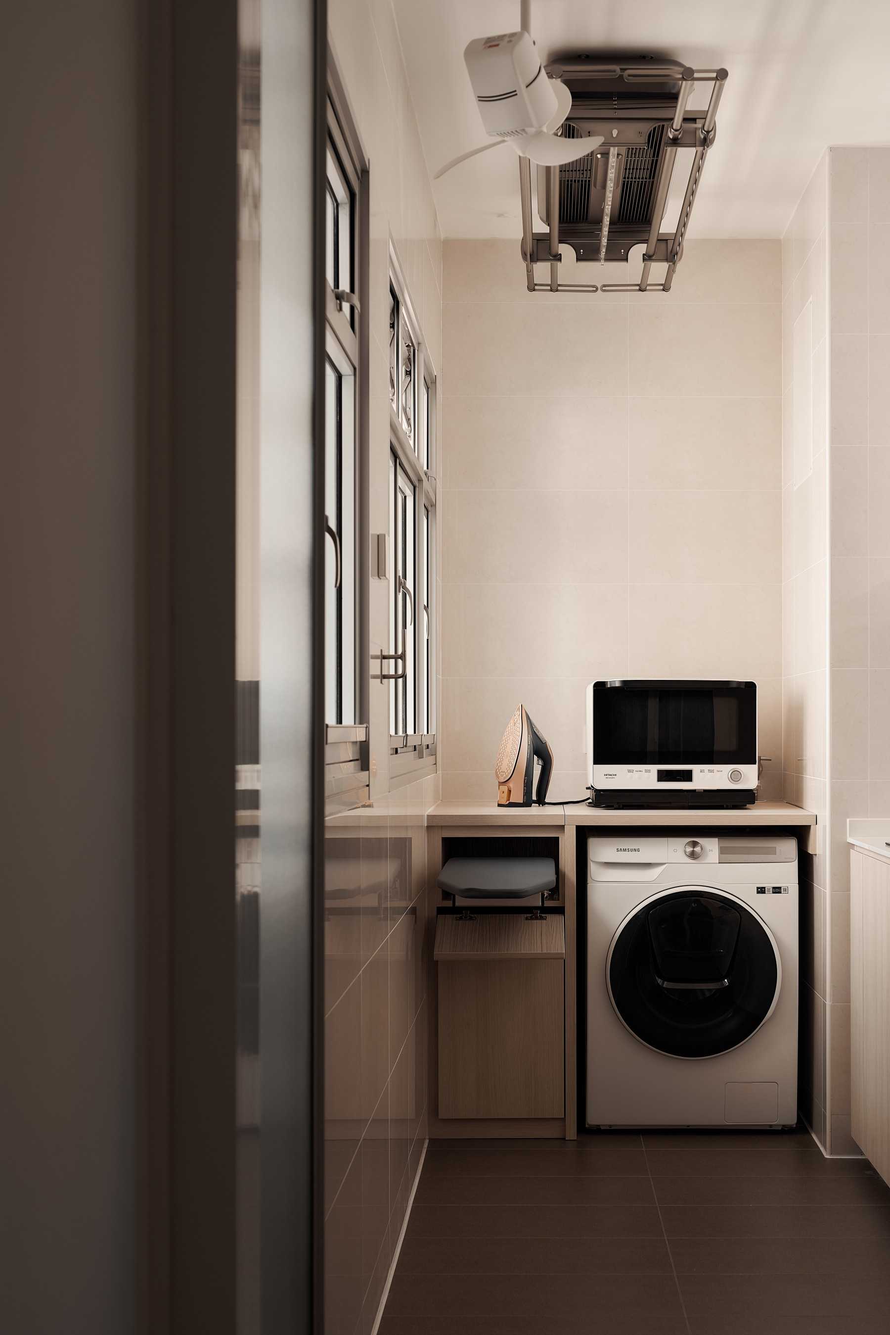 Minimalist Service Yard with Laundry Area and Ironing Board