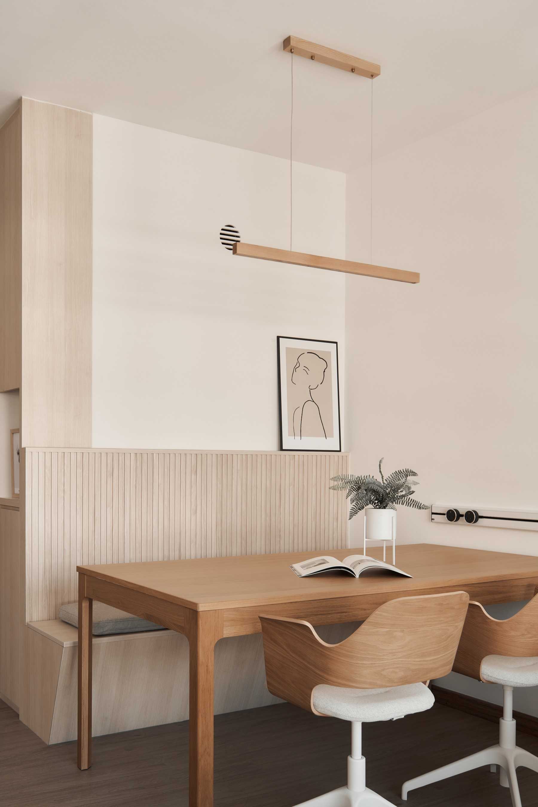 Minimalist Dining Room with Drop Light and Panelling