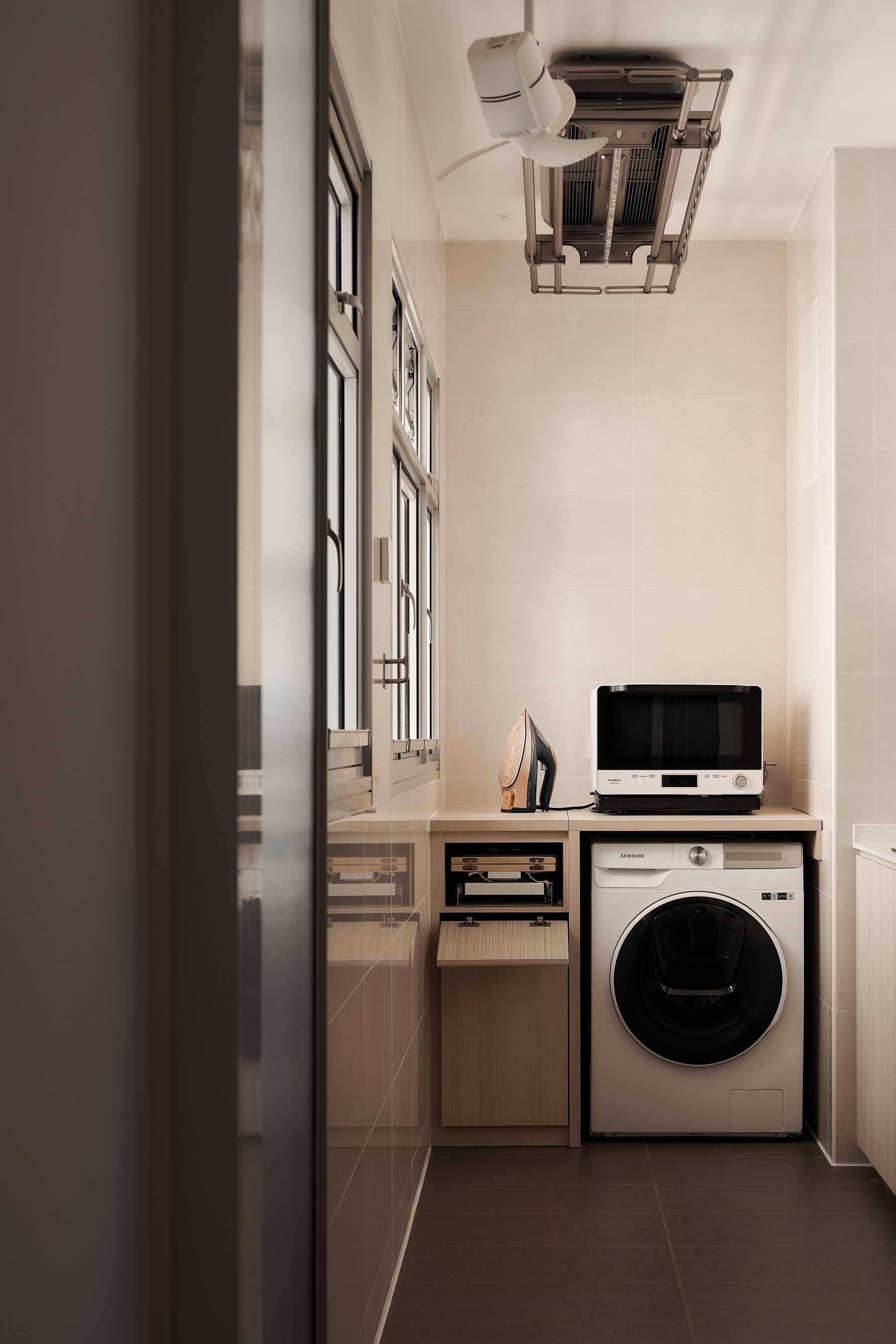 Minimalist Service Yard with Laundry Area and Ironing Board