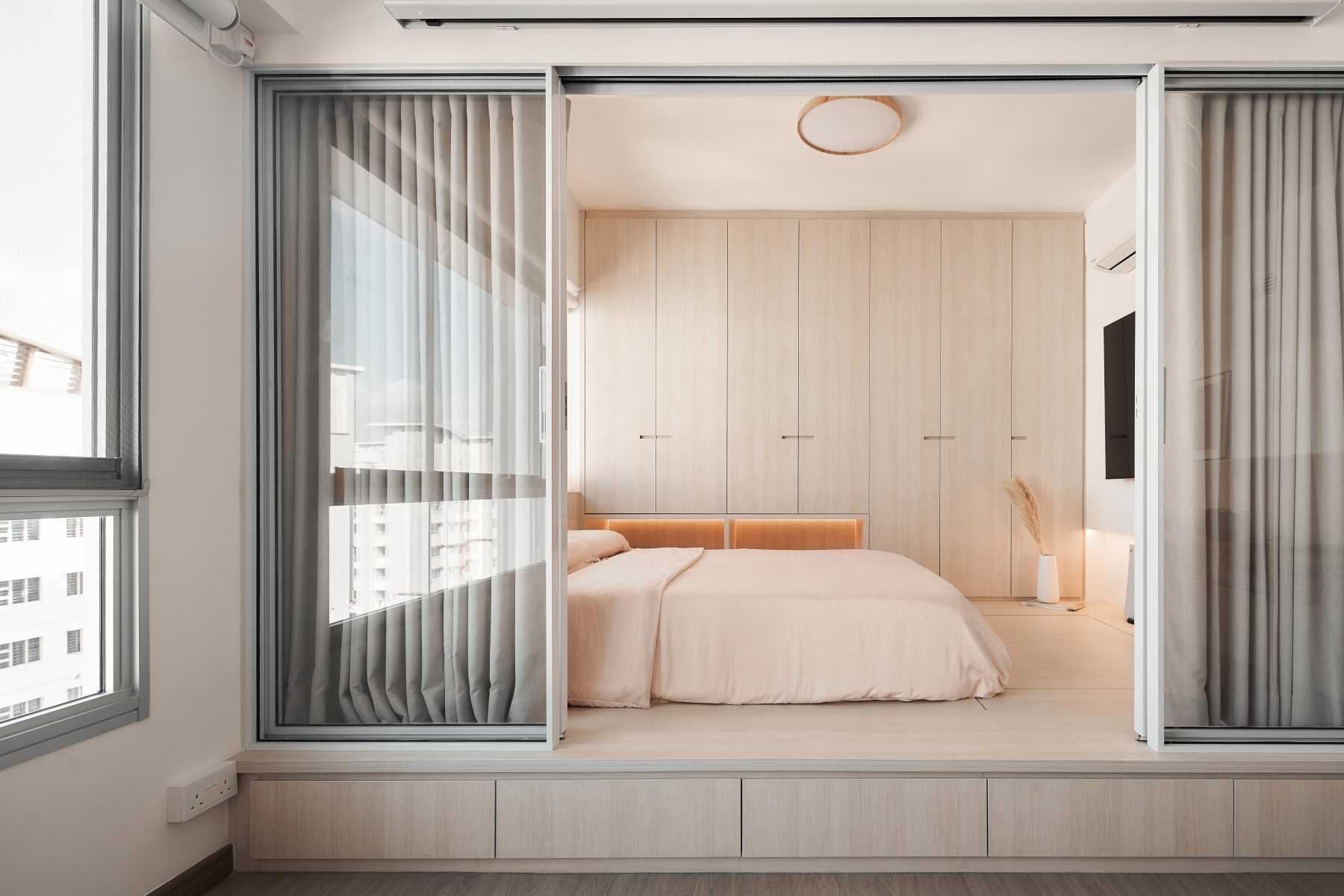 Minimalist Bedroom with Platform Bed and Storage Cabinets