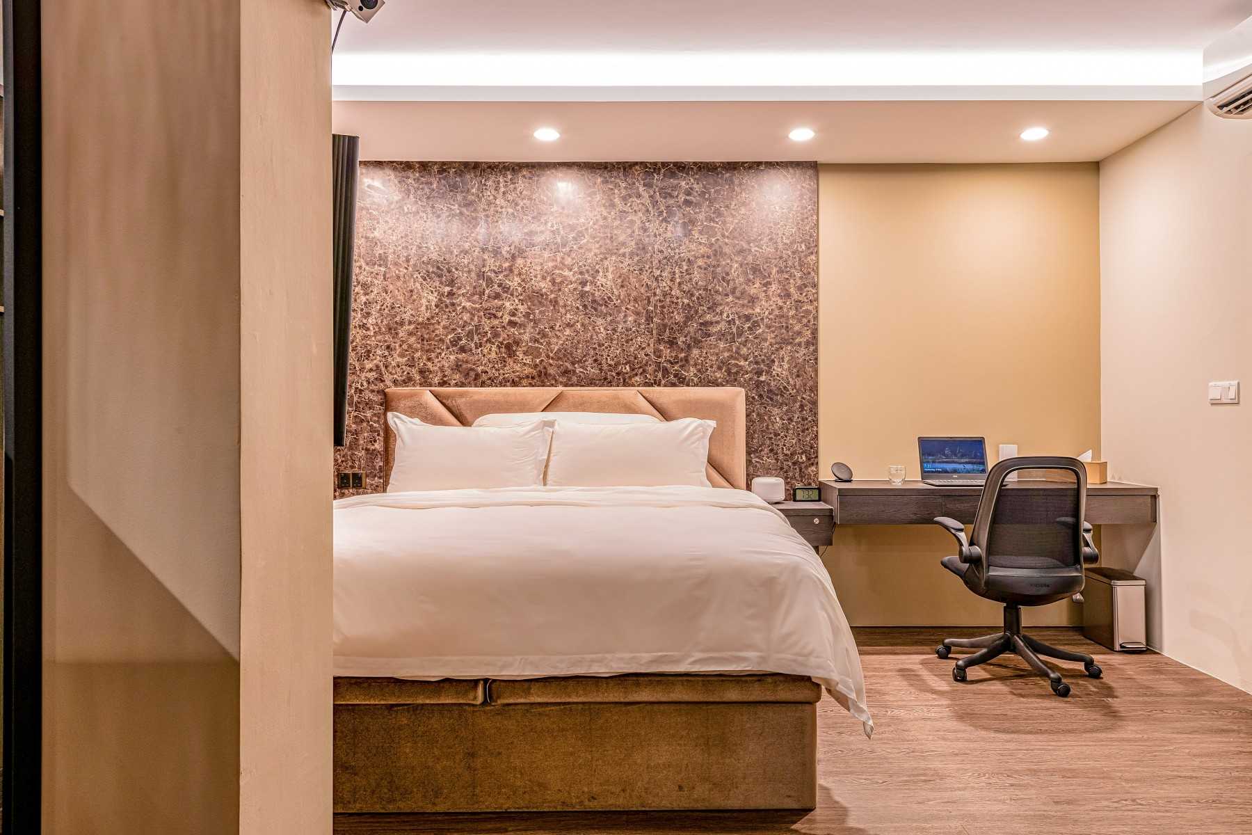 Modern Bedroom with Feature Wall and Ceiling Light