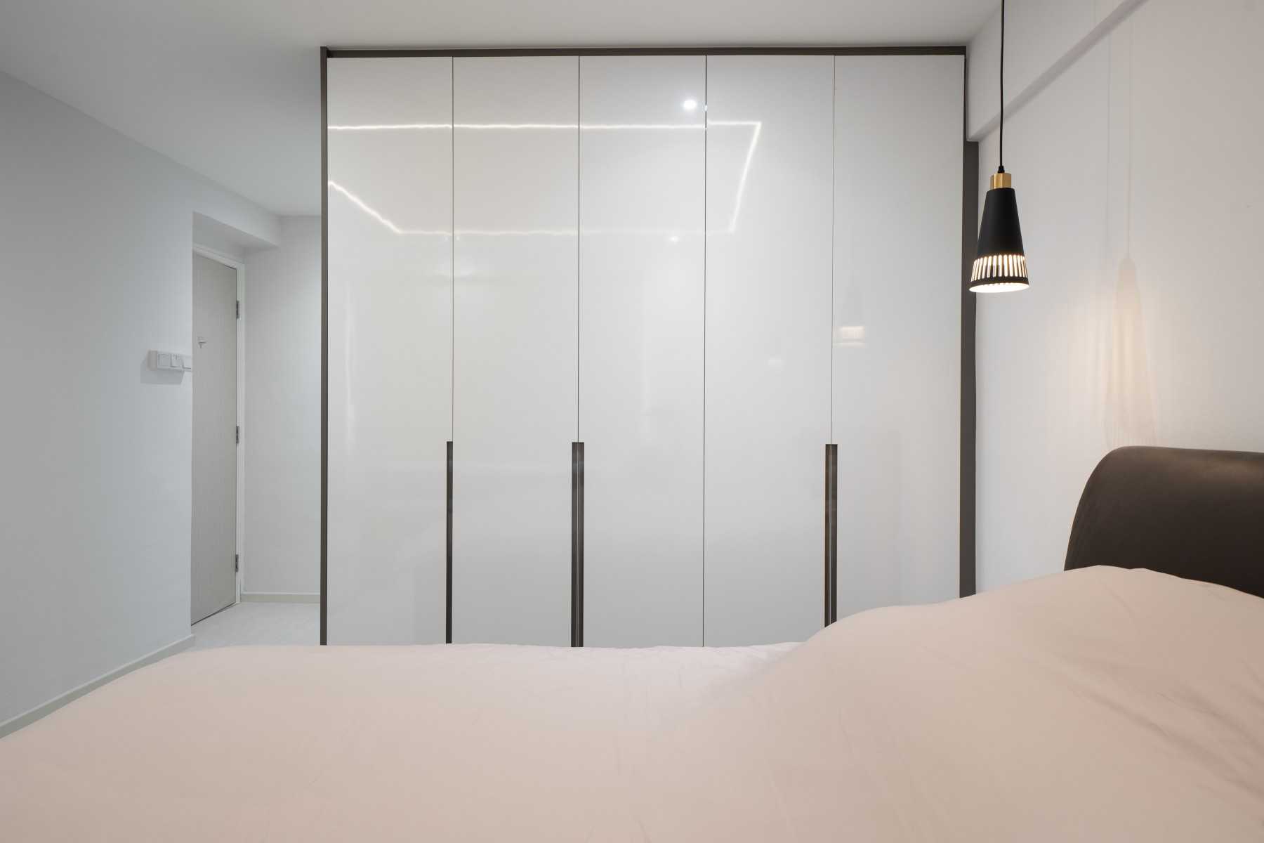 Contemporary Bedroom with Herringbone Tiling and Wardrobe