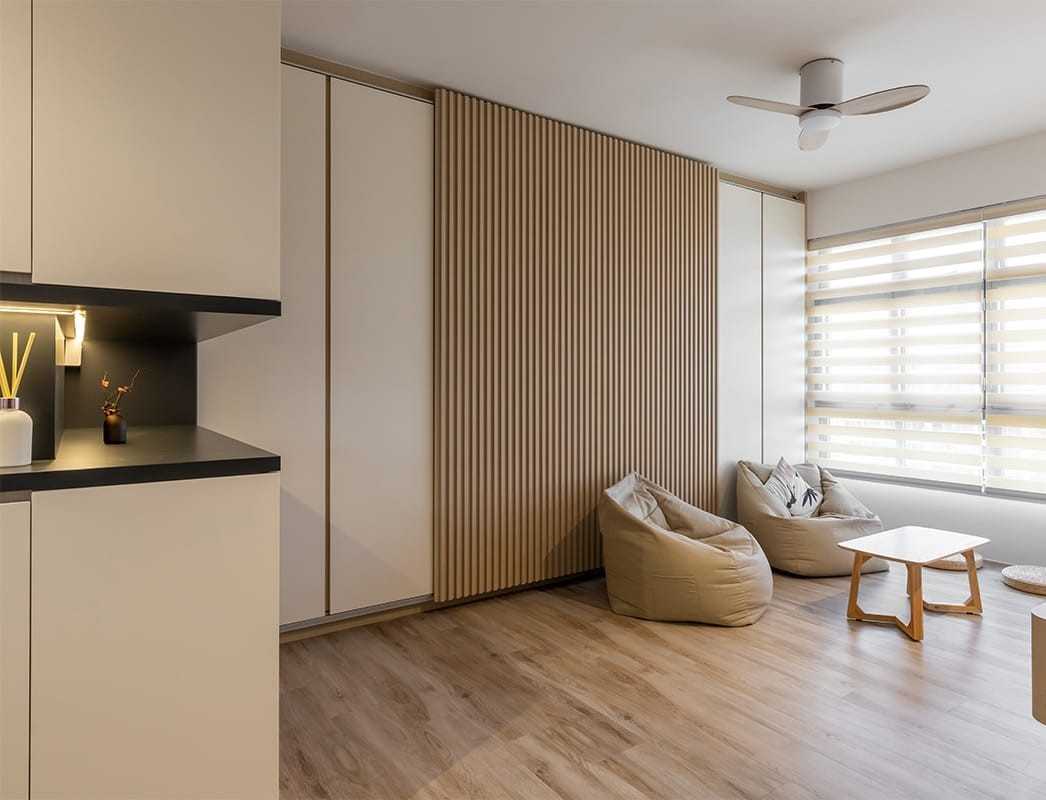 Asian Living Room with Bookshelf and Wood Flooring