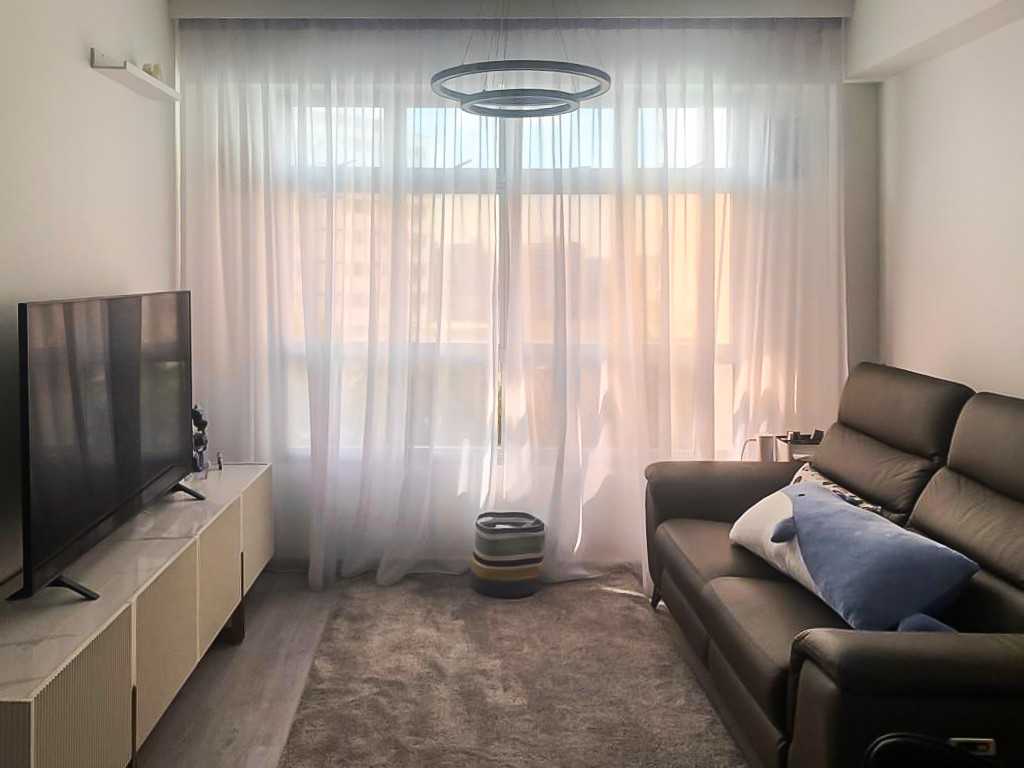 Scandinavian Living Room with TV Console and Window Grille
