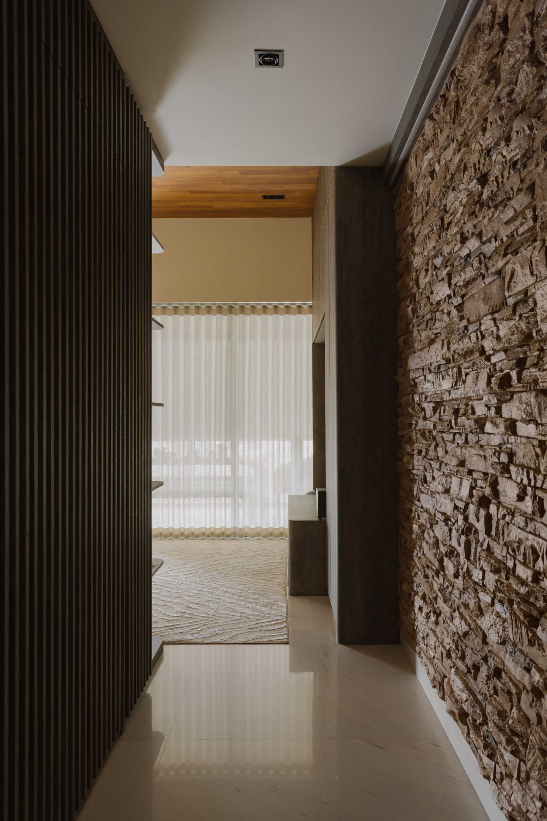 Minimalist Entryway with TV Console and Feature Wall