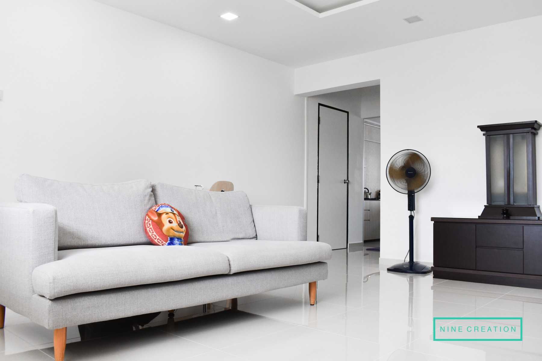 Minimalist Living Room with Bookshelf and Homogeneous Tiles