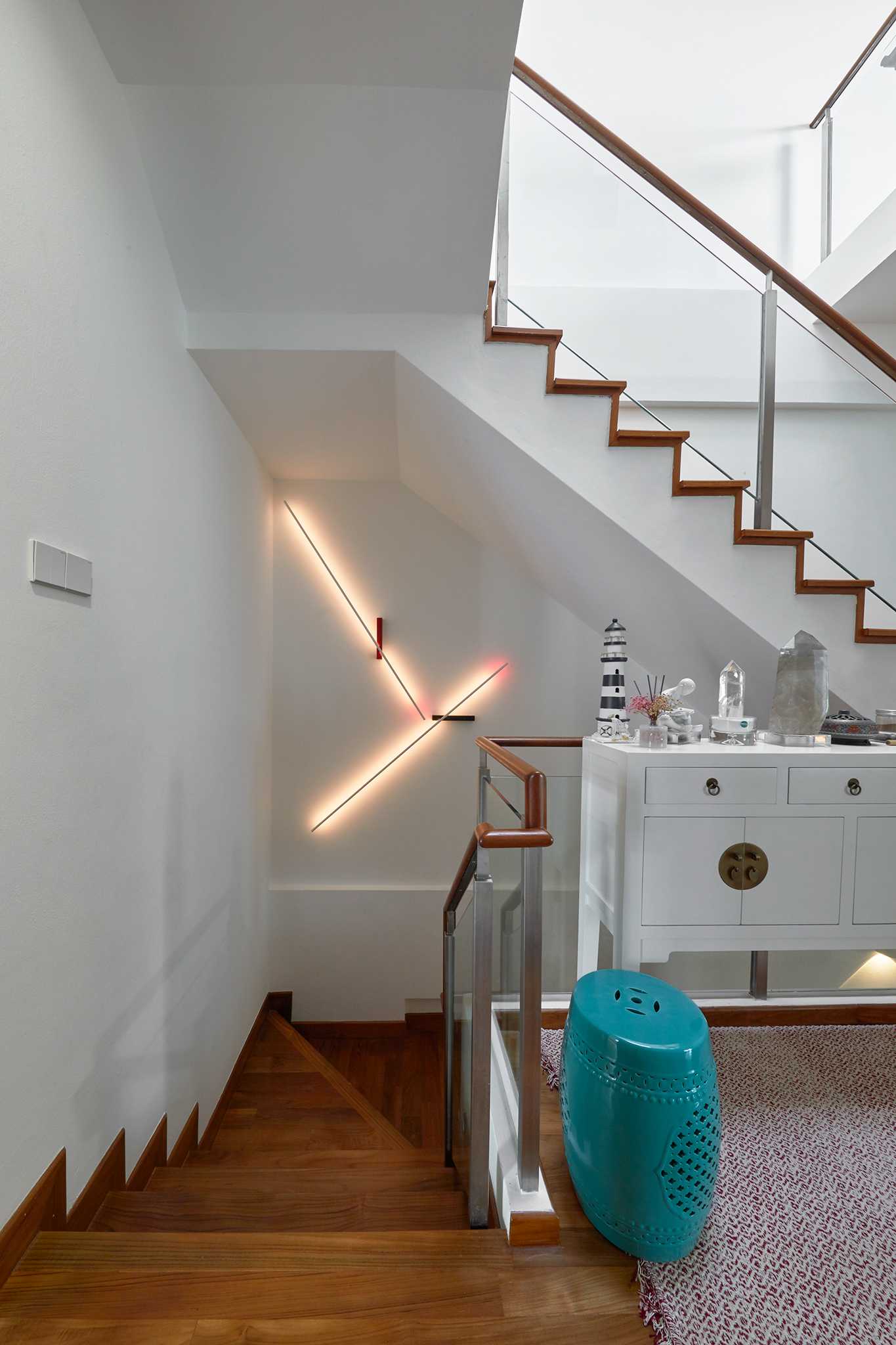 Scandinavian Hallway with Staircase and Paintings