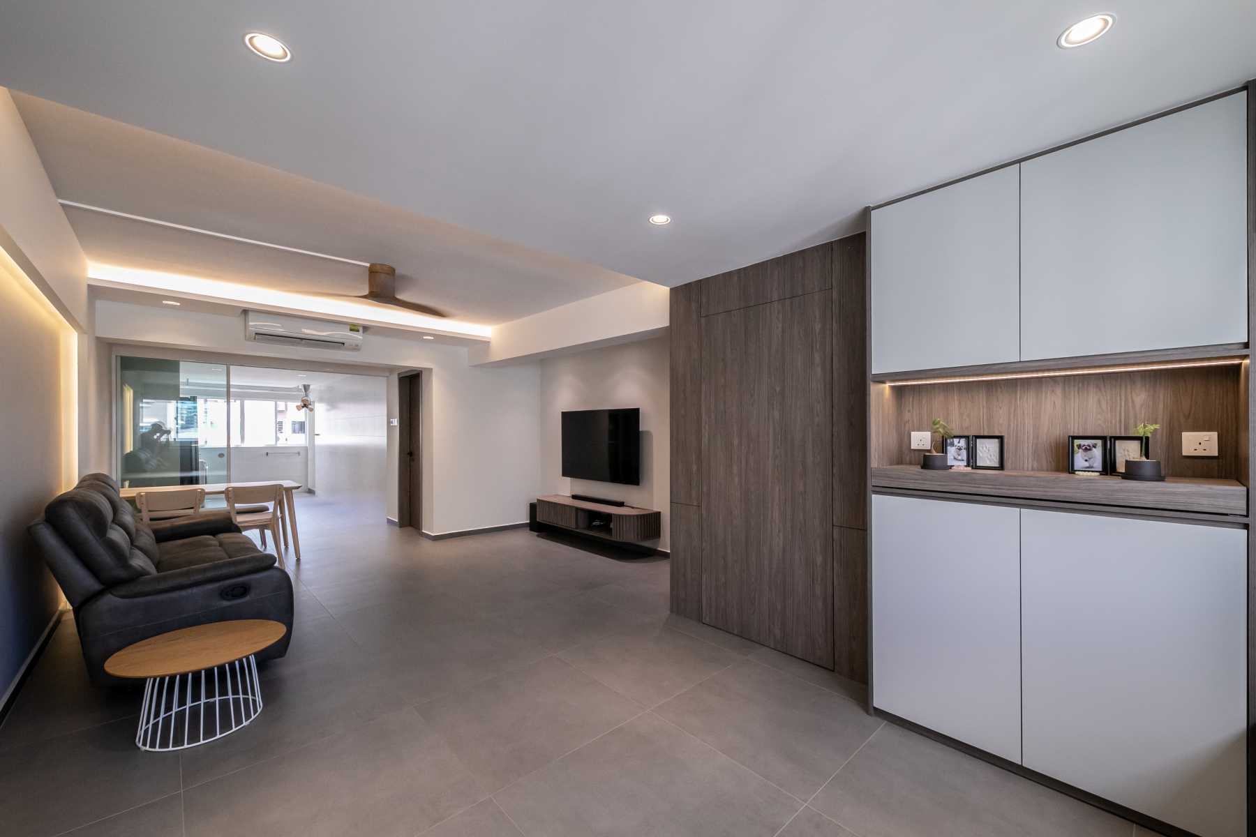 Minimalist Living Room with Homogeneous Tiles and TV Console