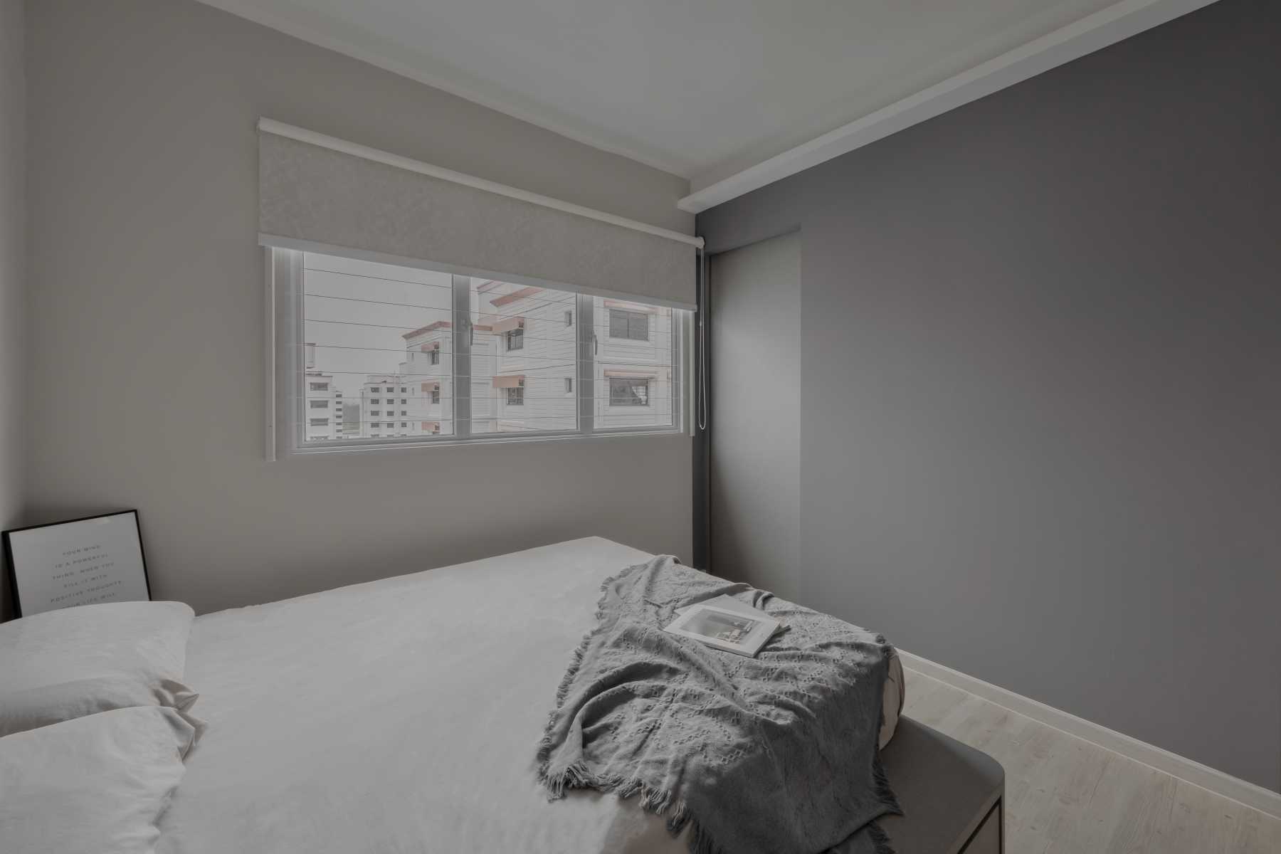 Scandinavian Bedroom with Wood Flooring and Window Shutters